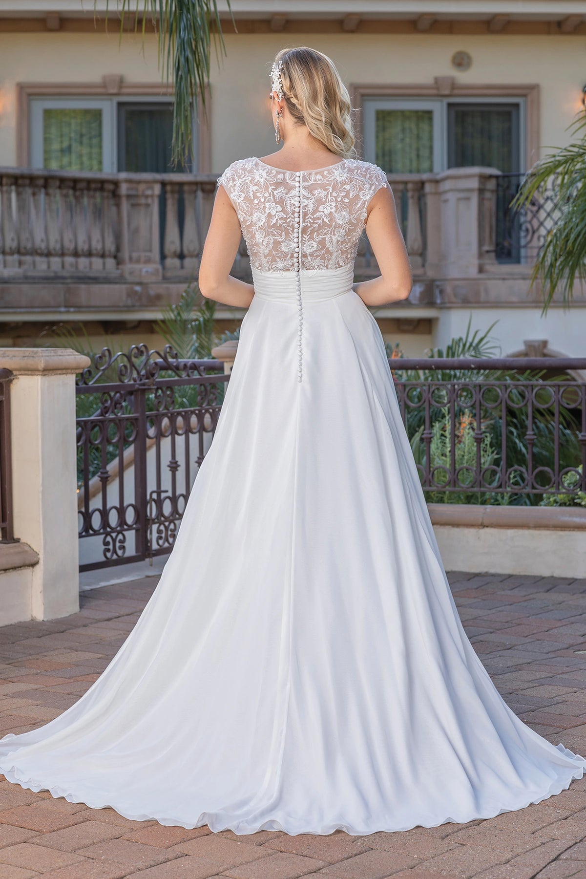 From the back, the Off-White wedding dress reveals its floor-length skirt.