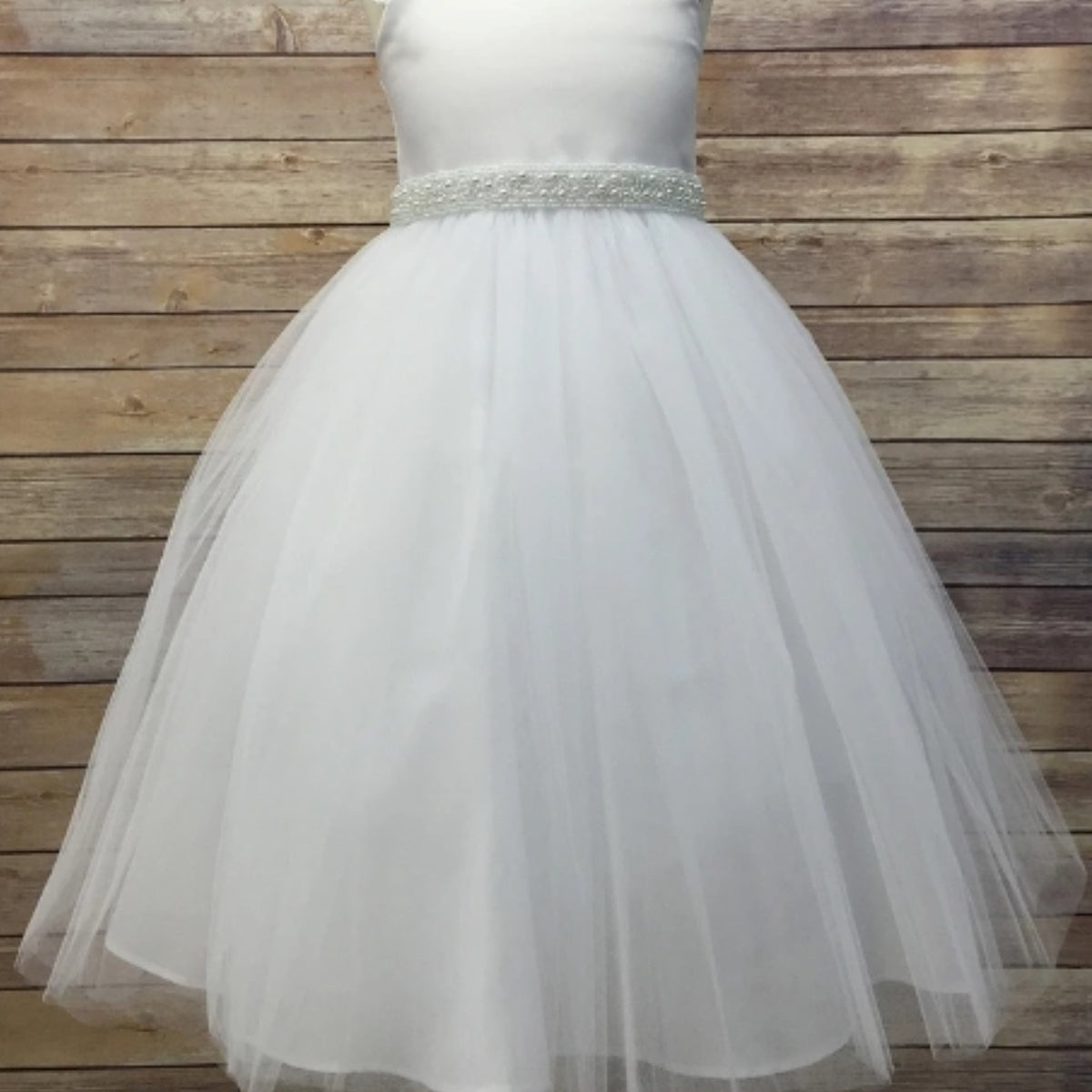 Front view presents ivory and white pearl satin flower girl sash belt,.