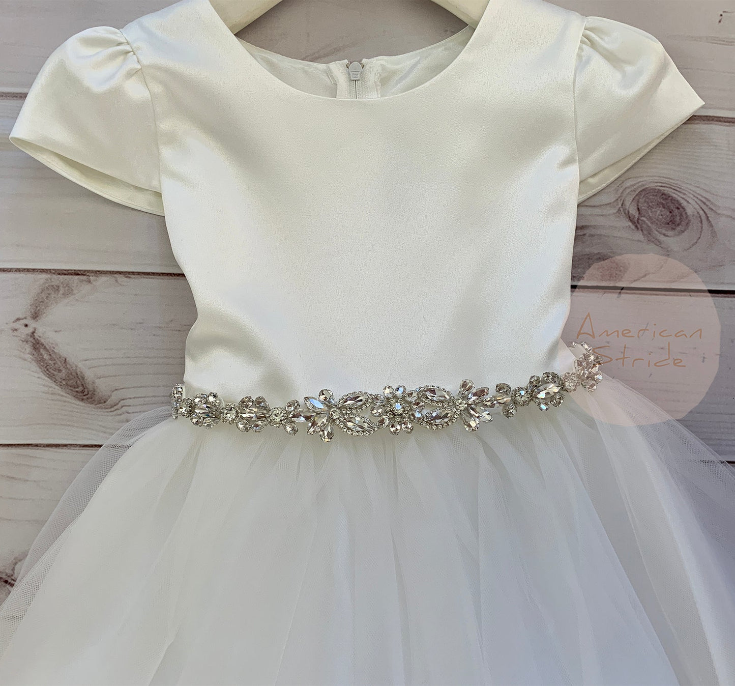 Silver rhinestone floral flower girl sash belt, front view.