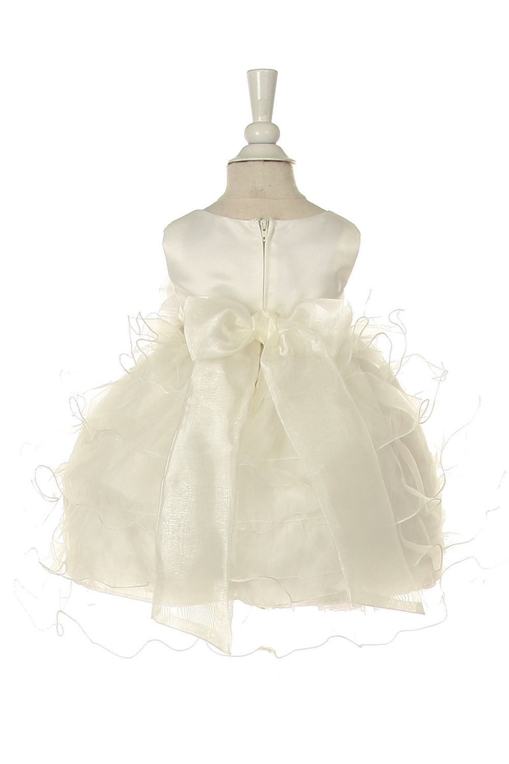 Back view of ivory rose flower girl dress at wedding or christening event.
