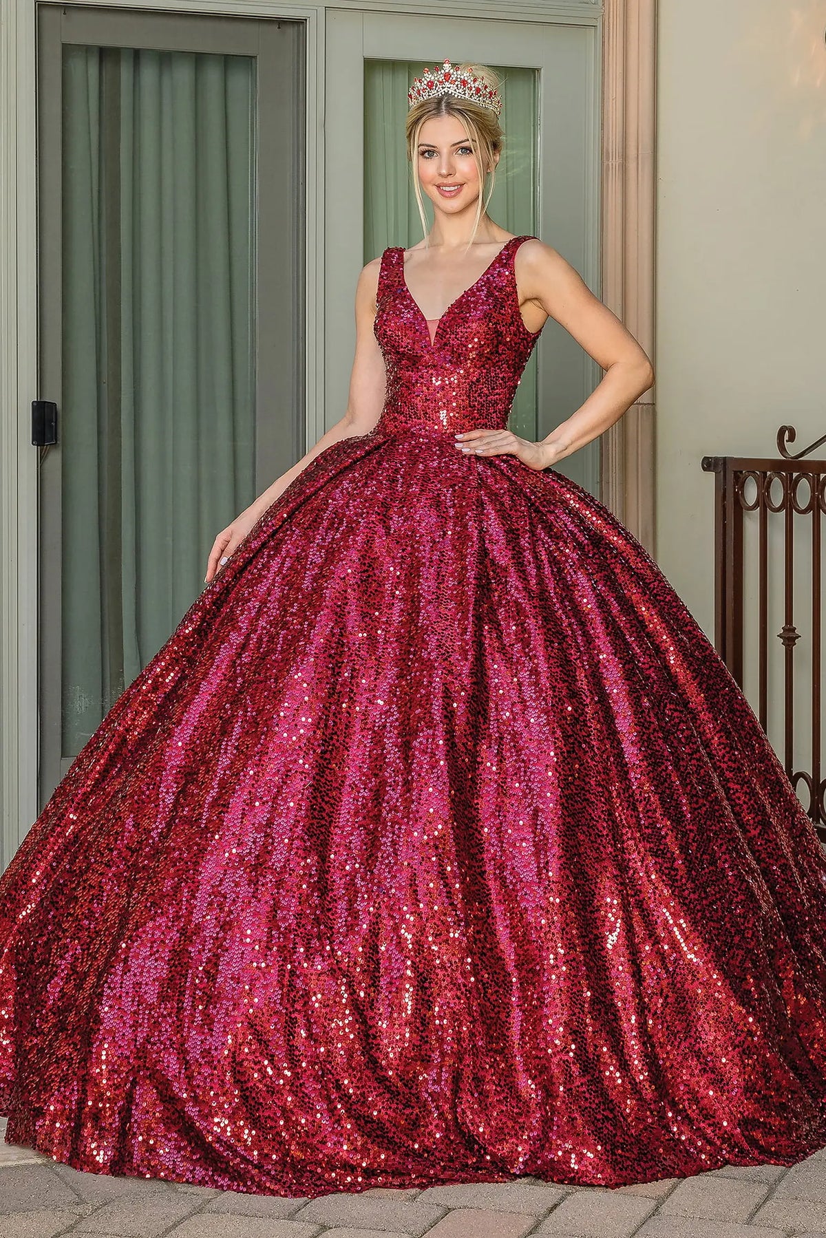 Featuring a floor-length skirt, this Burgundy quinceañera ball gown is shown in full view.