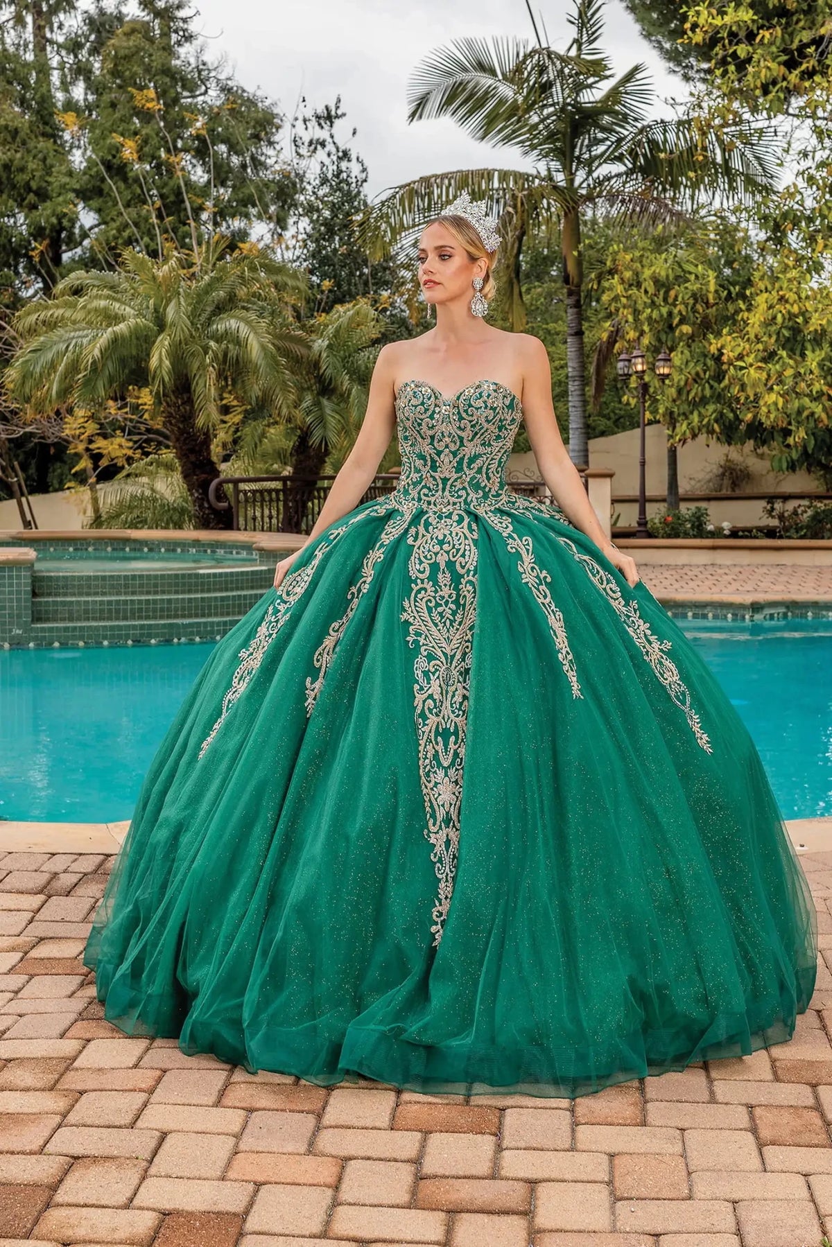 Front view of a Hunter Green quinceañera gown with strapless neckline, beaded bodice, and full tulle skirt