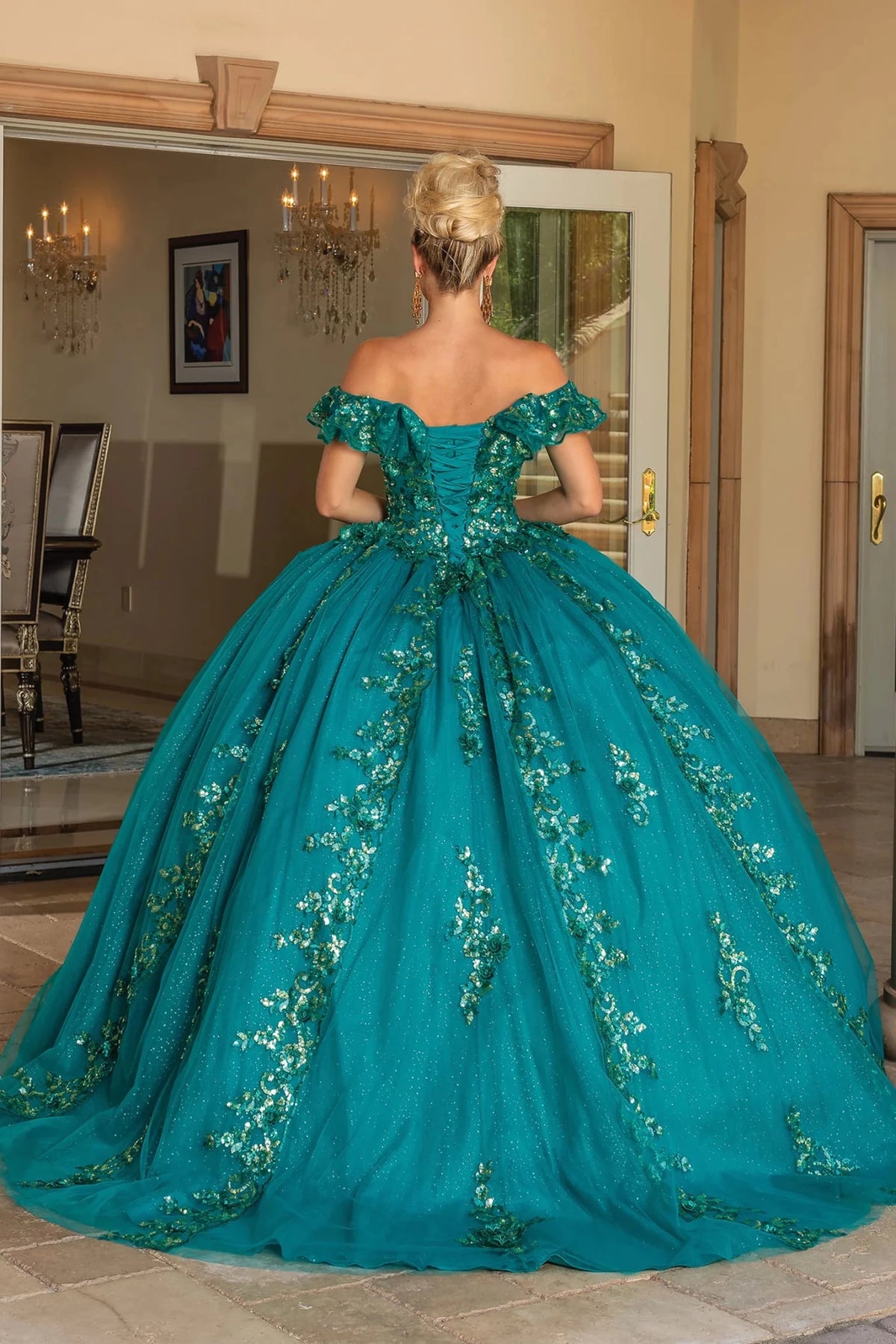 Back view of a Hunter Green quinceañera gown showing lace-up back