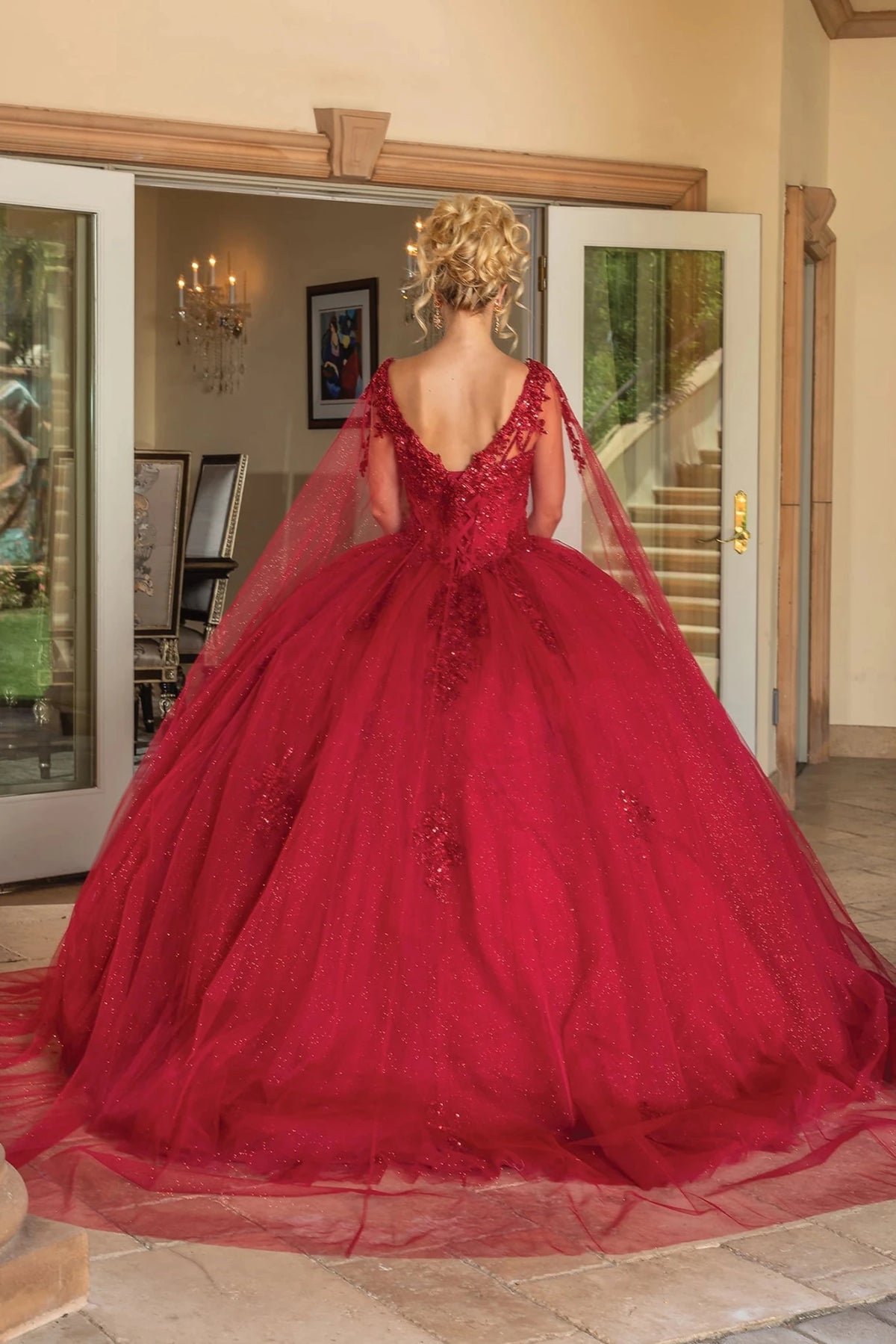 Back view of a Burgundy quinceañera gown showing lace-up back and beaded embroidery