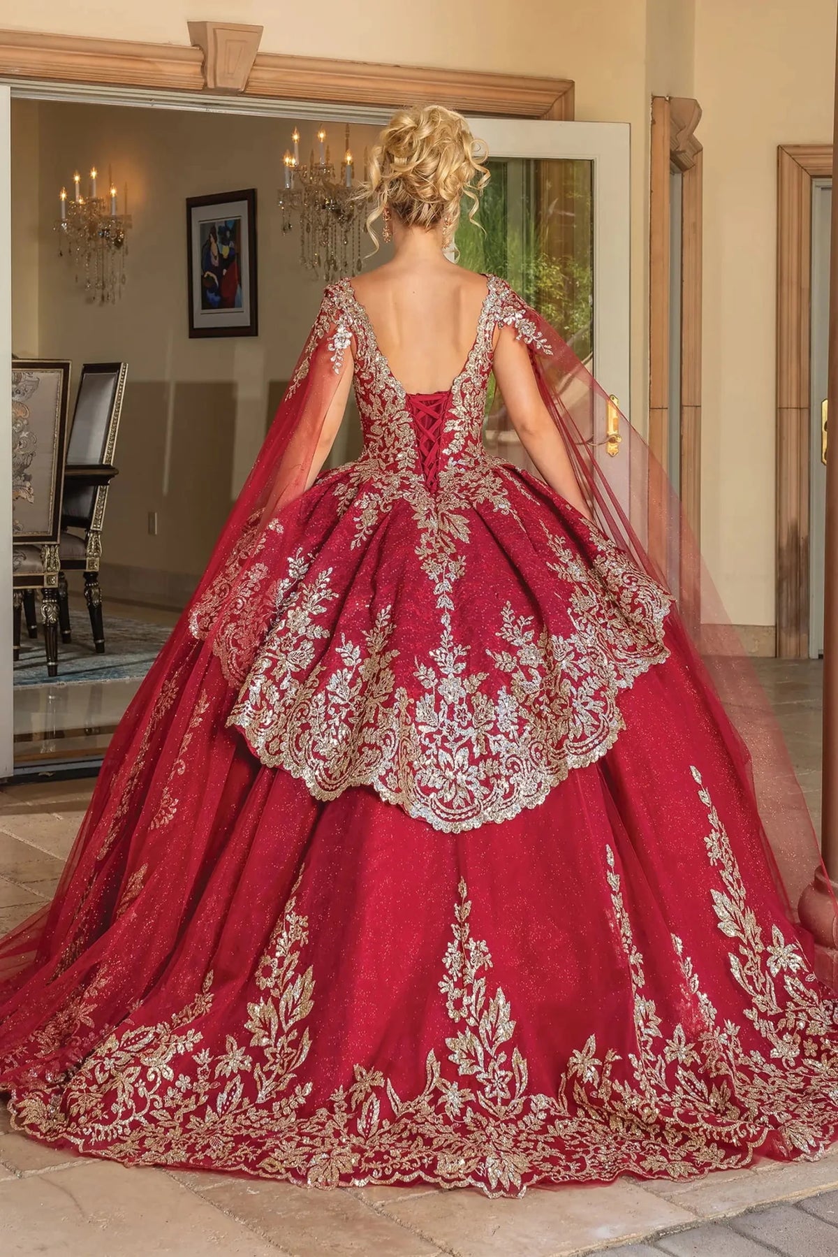 Back view of a Burgundy quinceañera gown showing lace-up back and sheer long sleeves