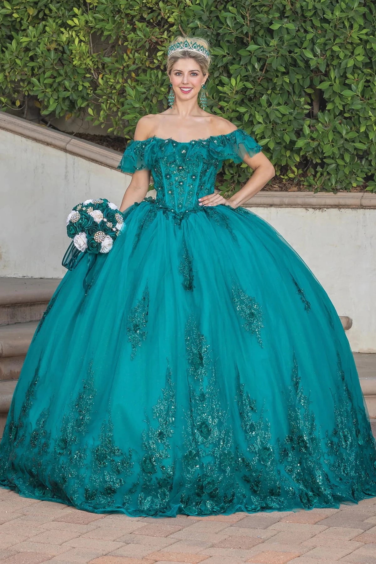 Front view of a Teal quinceañera gown with off-the-shoulder neckline, corset bodice, floral embroidery, and embroidered tulle skirt