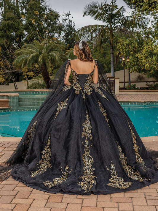 Quinceanera | Black Opulent Embroidered Gold Coiled Off-Shoulder Glittered tulle Ballgown with Dramatic Train - back view of woman wearing dress