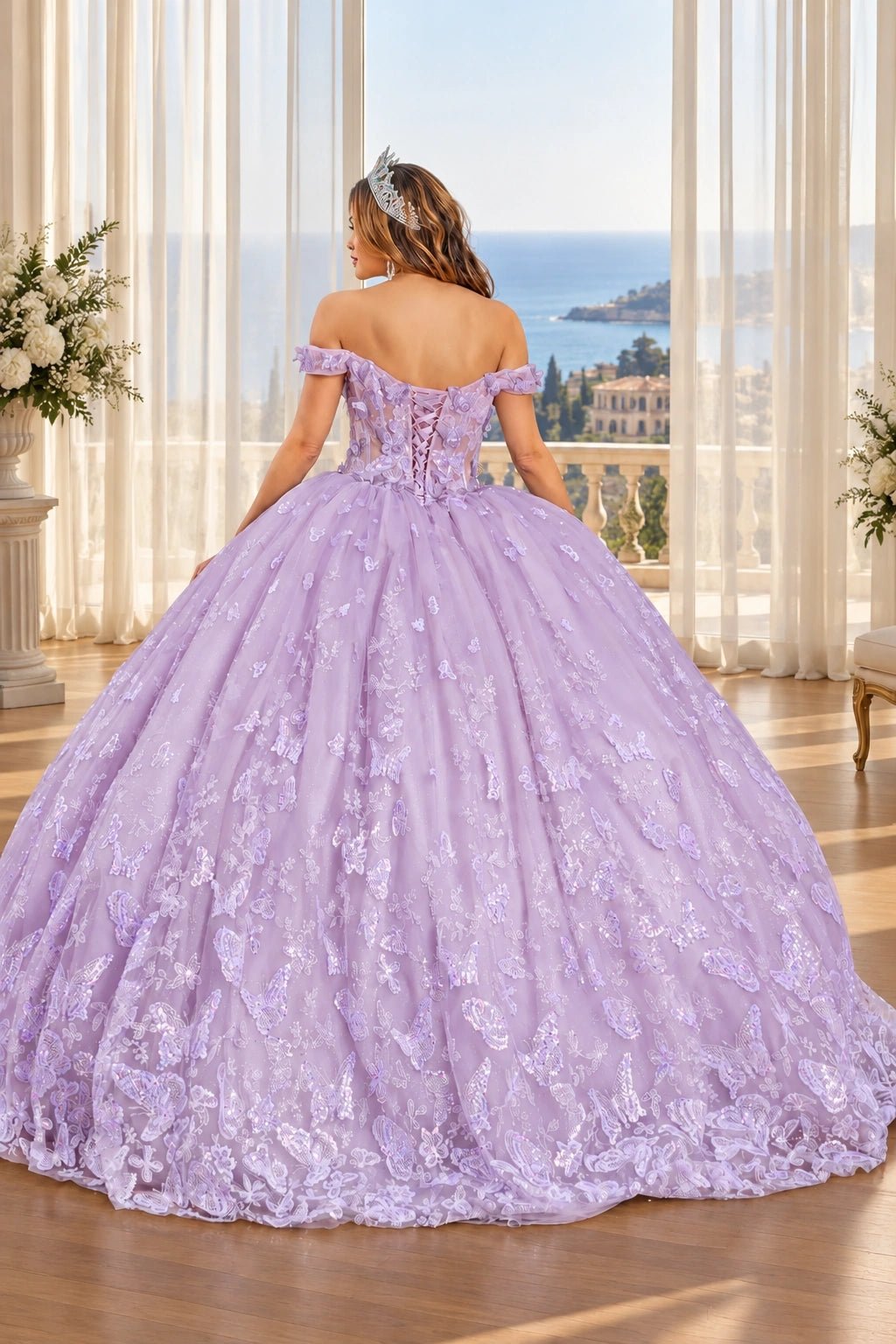 Lace-up back of the Lilac quinceañera ball gown with butterfly embroidery across the full skirt.