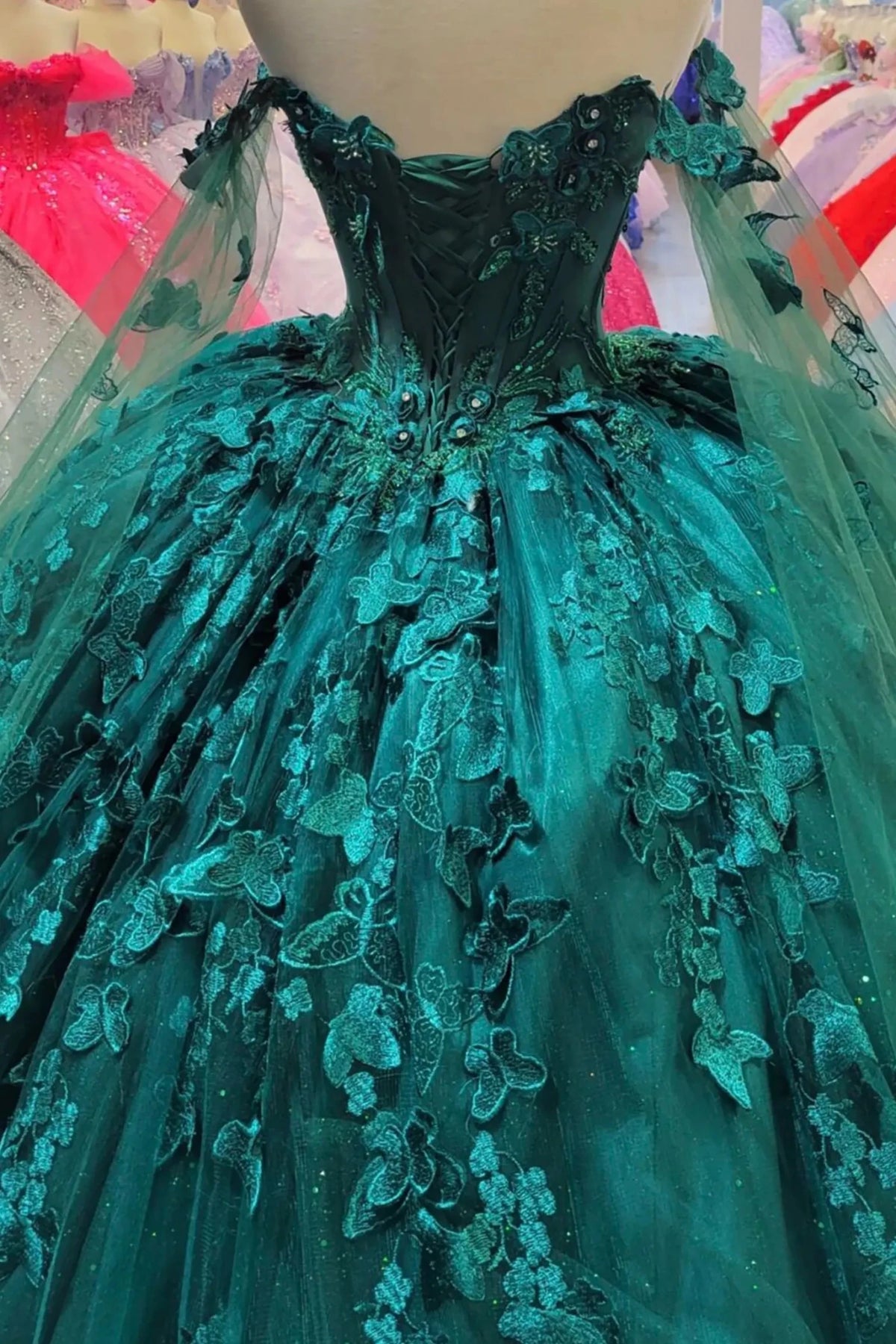 hunter green quinceanera dress with lace-up corset back, butterfly and floral applique