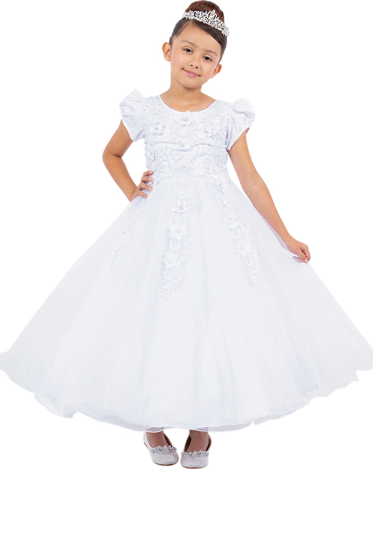 White communion dress with floral appliques above a full tulle skirt.