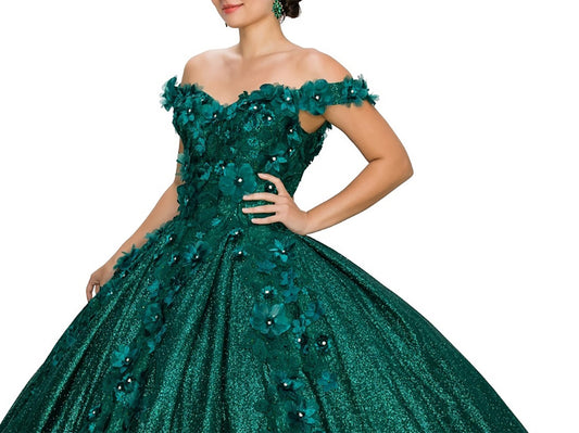 Hunter Green Quinceanera | 6 Colors | 3D floral off-shoulder ball gown with glitter skirt, bottom pleated, corset back tie - zoomed in view of woman wearing dress with one hand on her hip