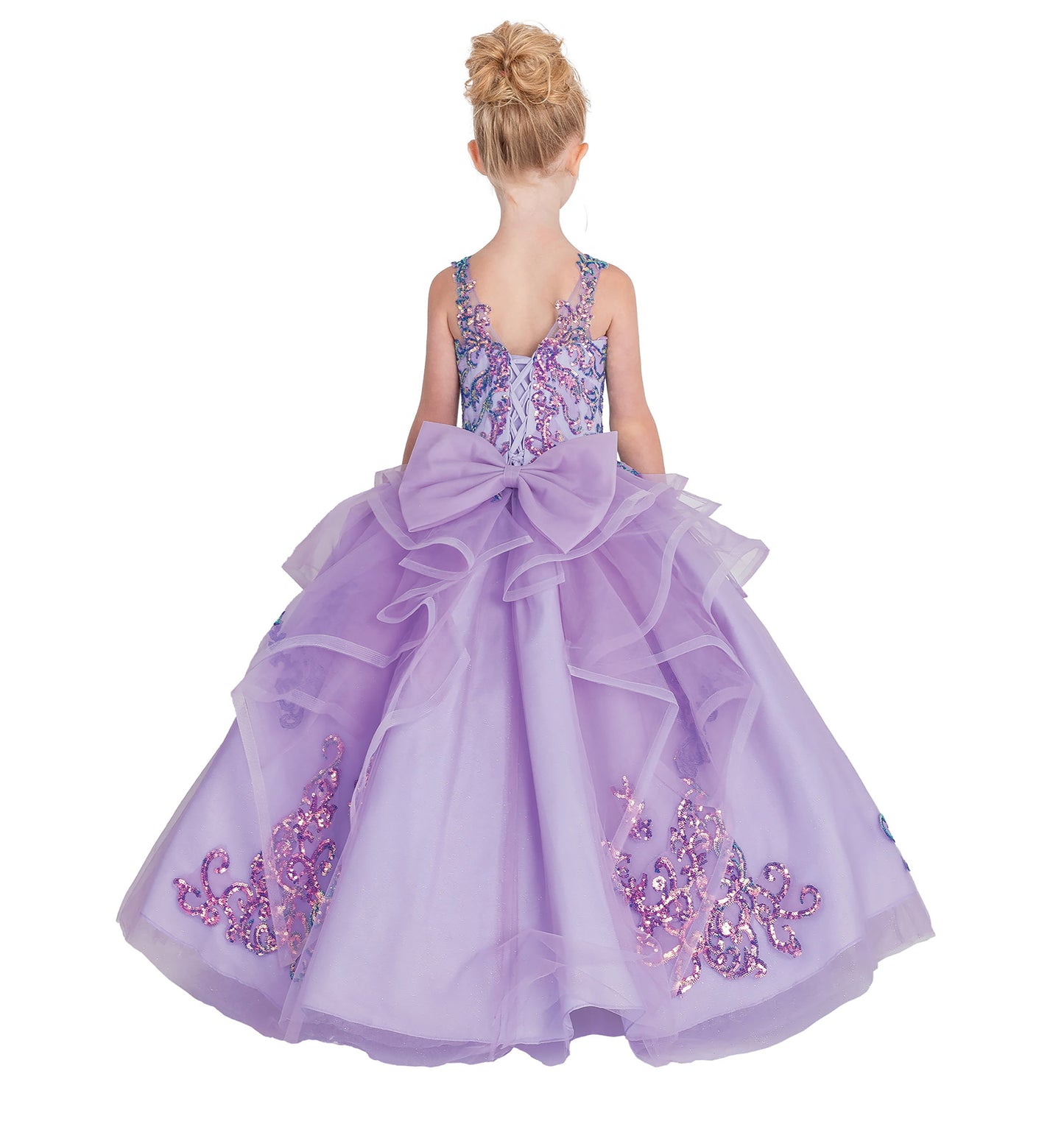 Lavender dress with floral embellishments and a large bow on a white background