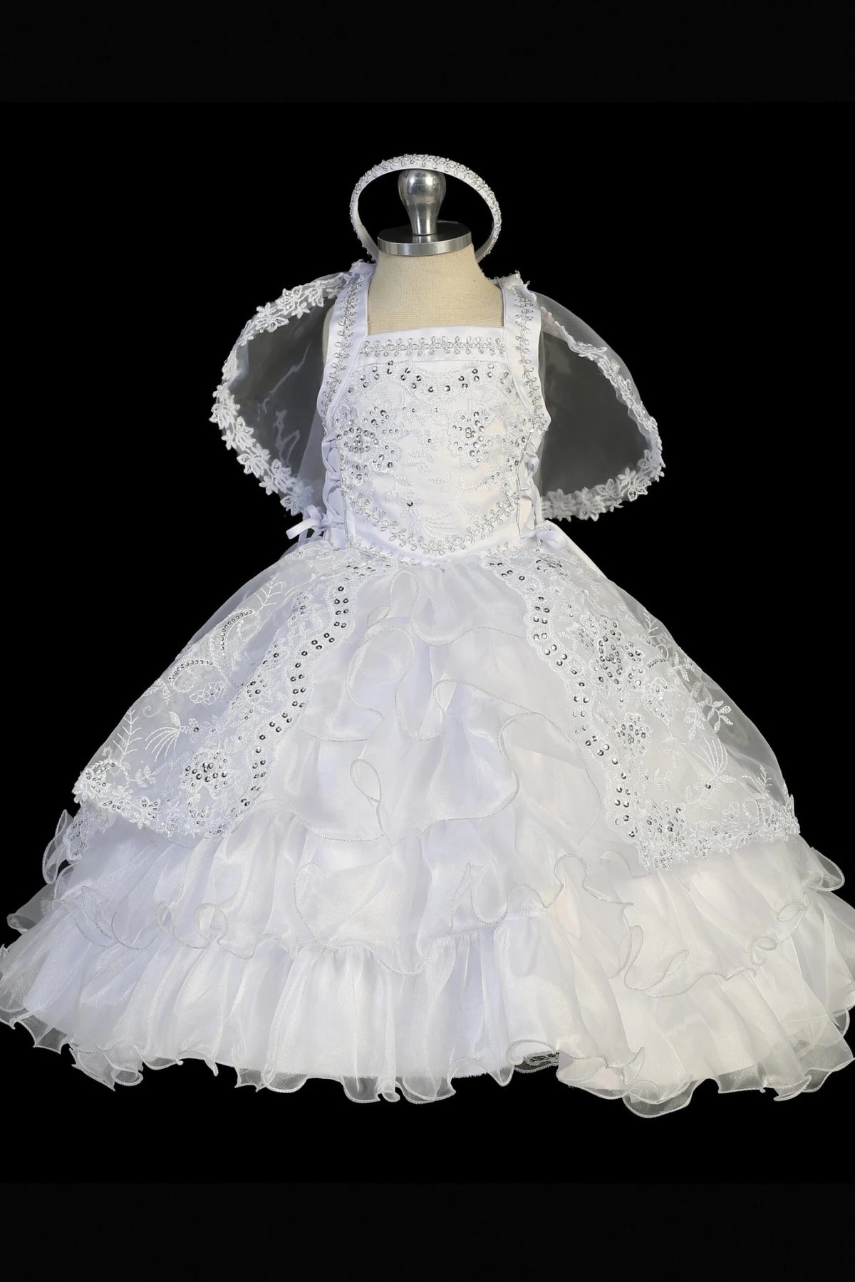 White baptism dress with sequined lace bodice and crisscross back straps.