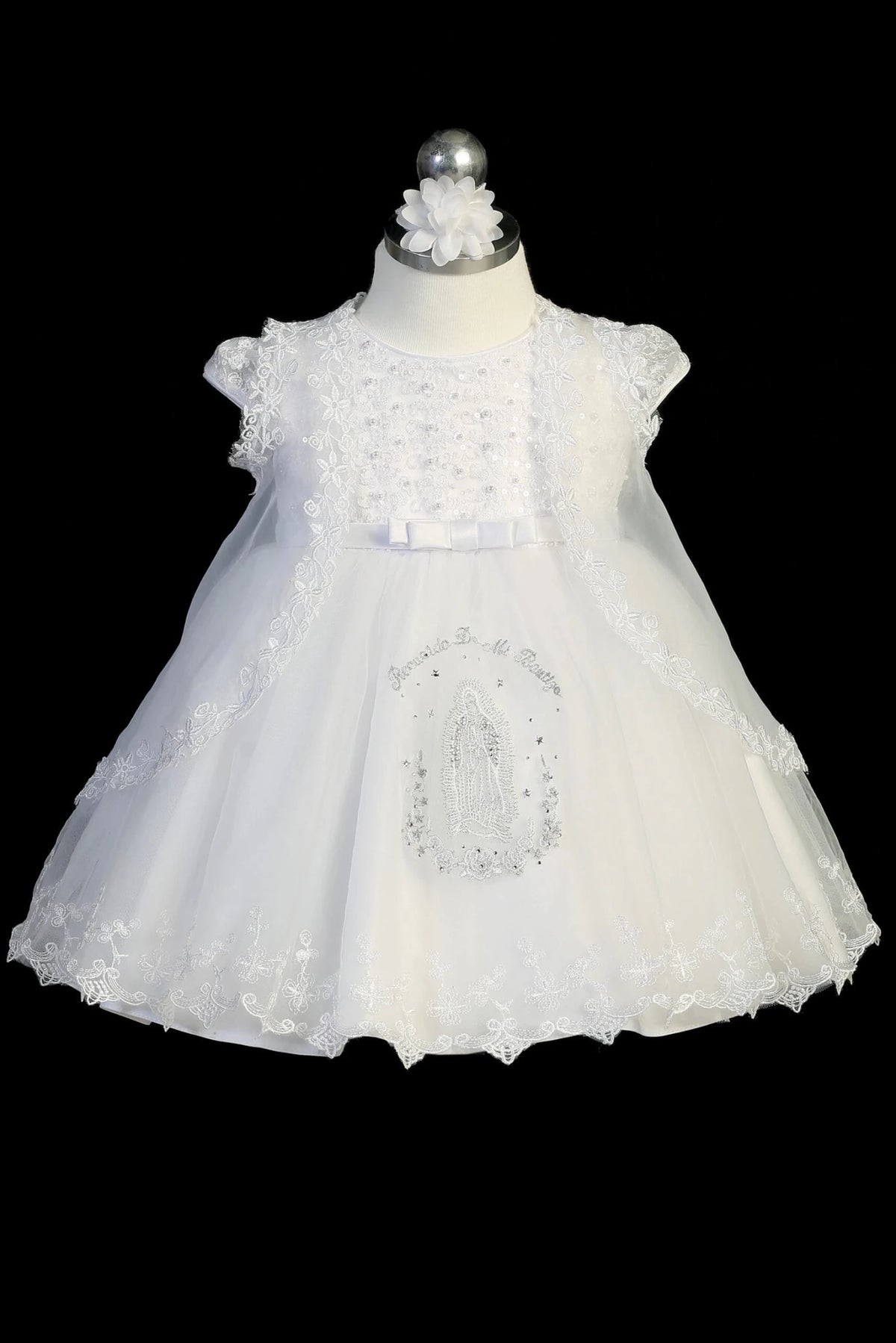 White baptism dress with cap-sleeved sequined bodice with scattered pearls.