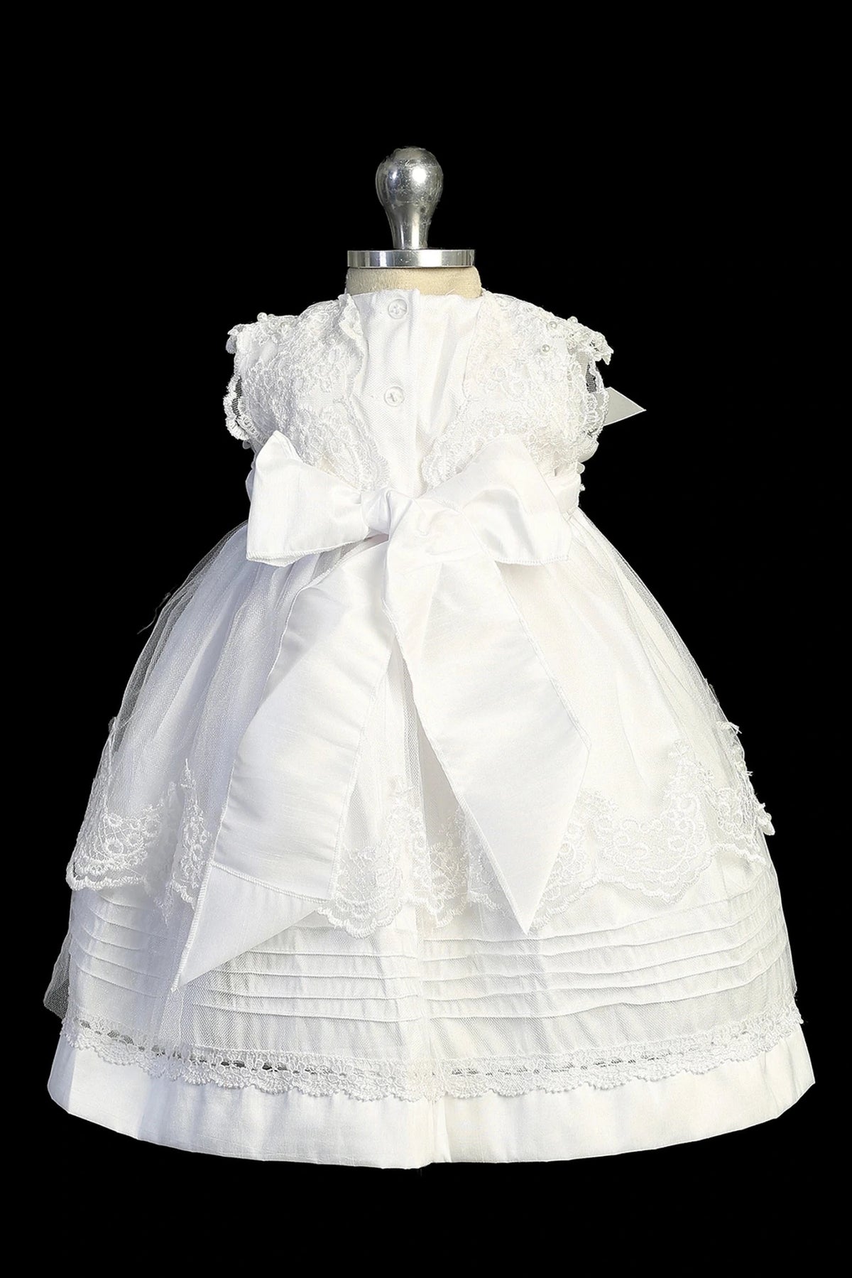 Back view of the Ivory christening dress showing bonnet and satin sash tie back.