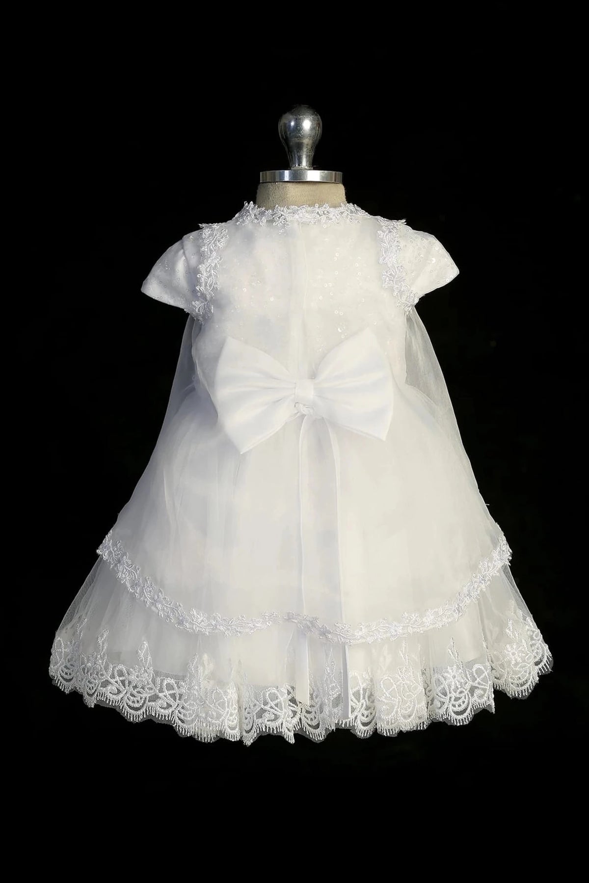 Back view of the White baptism dress showing satin waist bow at the back.