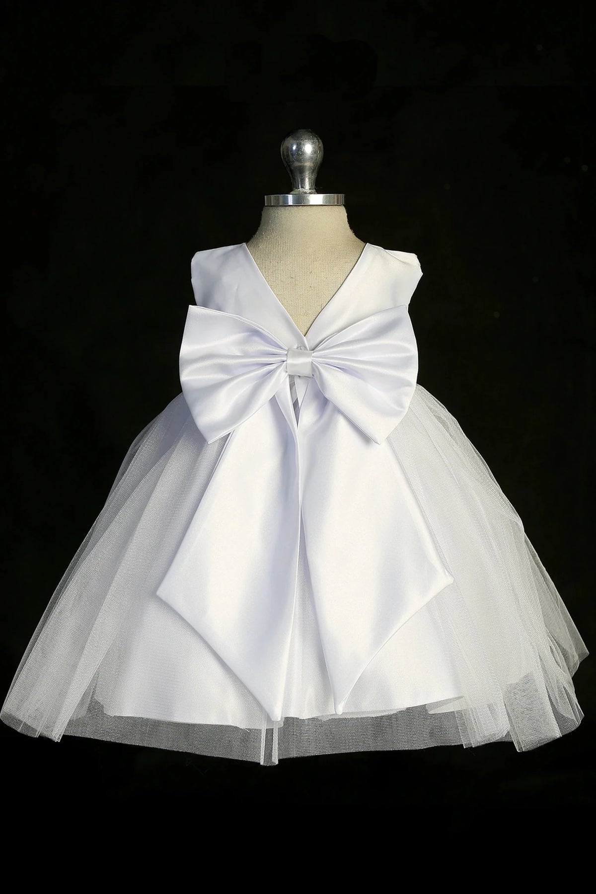 Back view of the White christening dress showing large satin back bow.