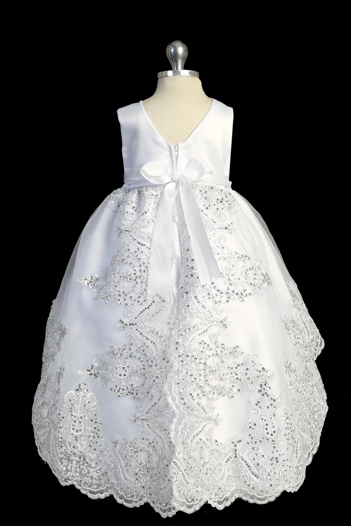 Back view of the White baptism dress showing V-shaped back and bow detail.