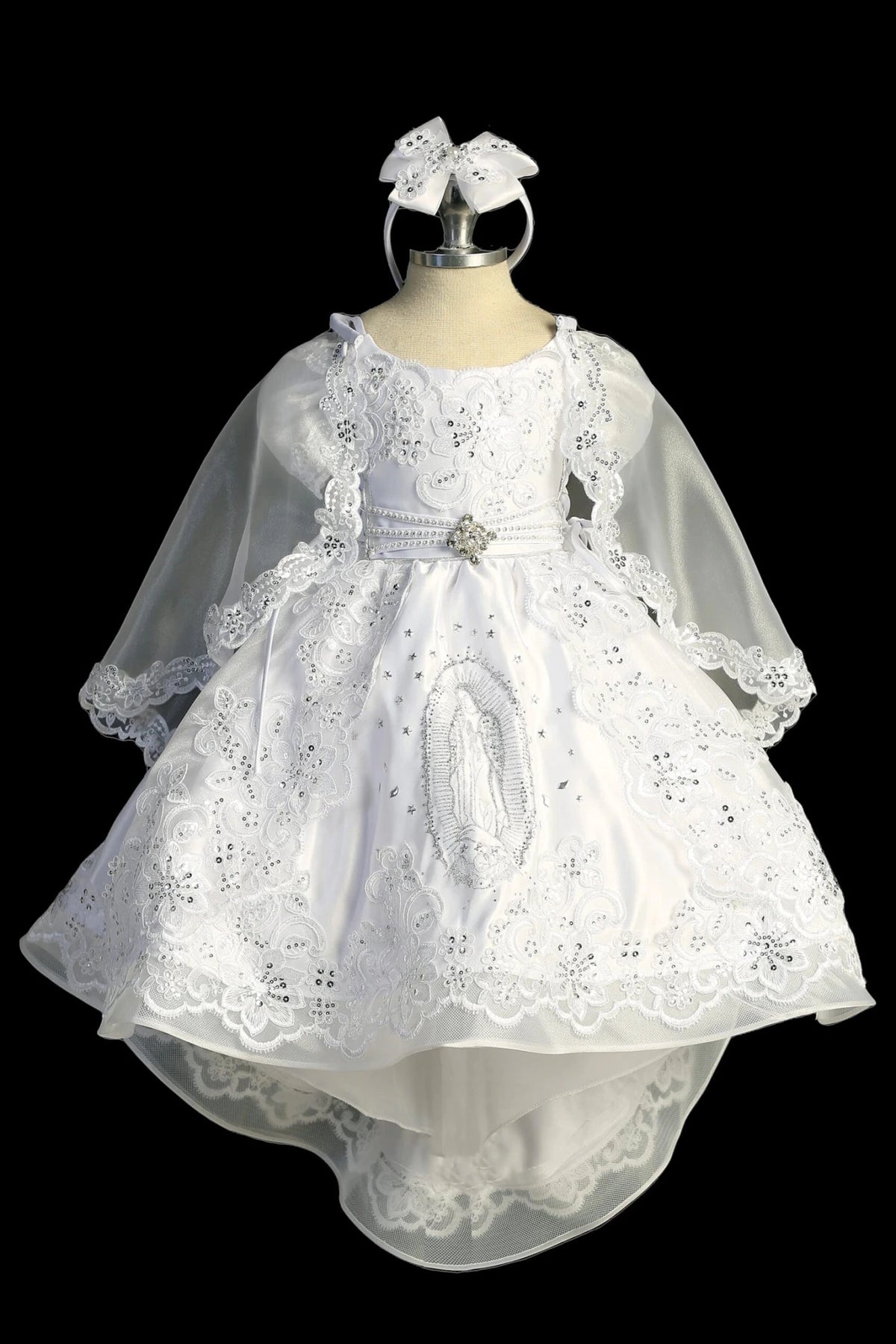 White baptism dress with cap-sleeved lace bodice and an embellished waist.