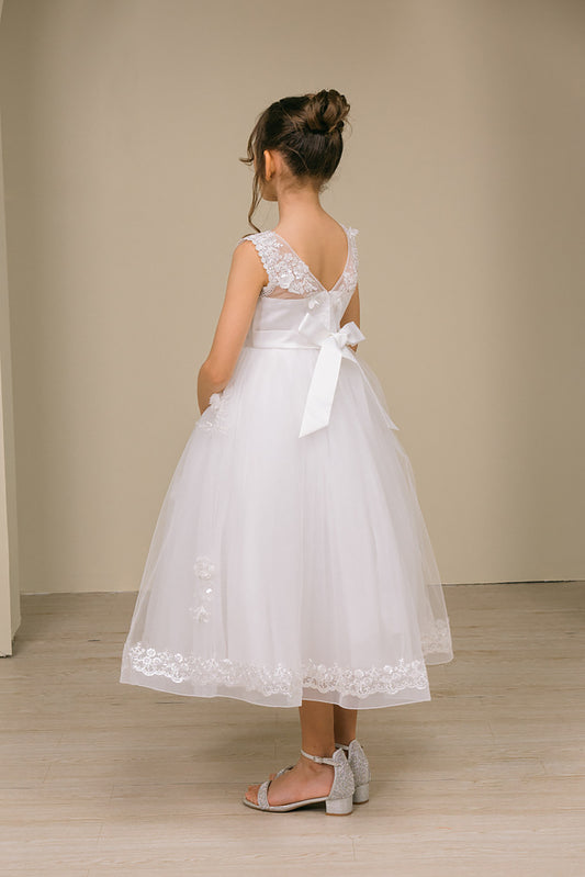 a girl wearing v back white floral lace dress on a beige background