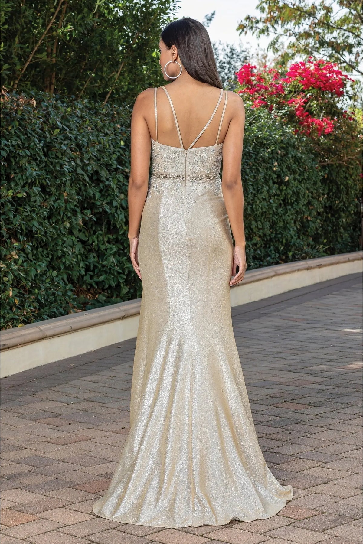 From the back, the Gold prom dress reveals its floor-length skirt.
