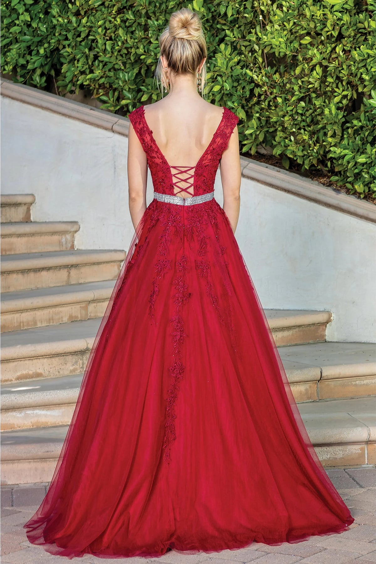 From the back, the Burgundy prom dress reveals its floor-length skirt.