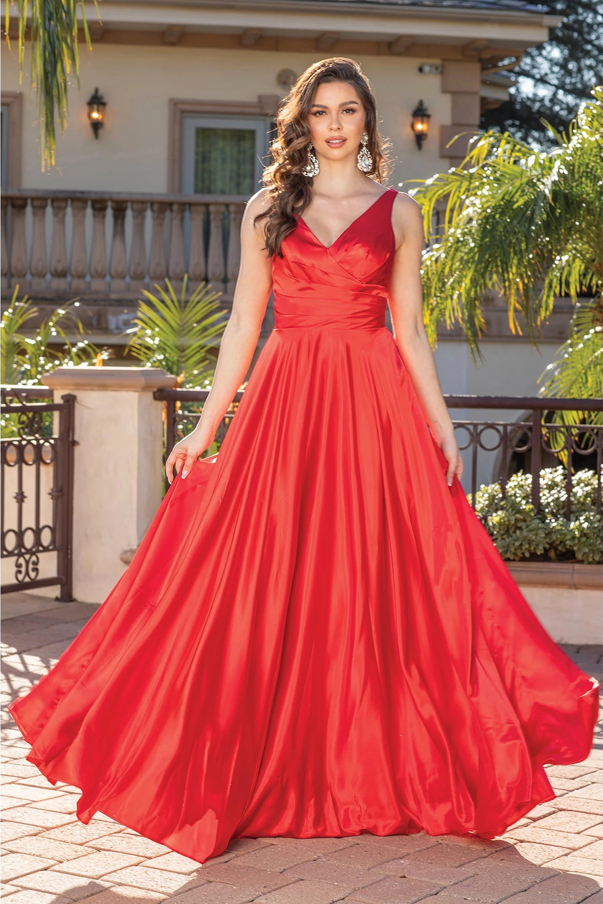 From the front, the Red prom dress reveals its floor-length skirt.