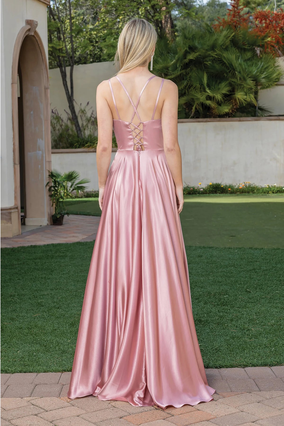 From the back, the Rose Gold prom dress reveals its floor-length skirt.