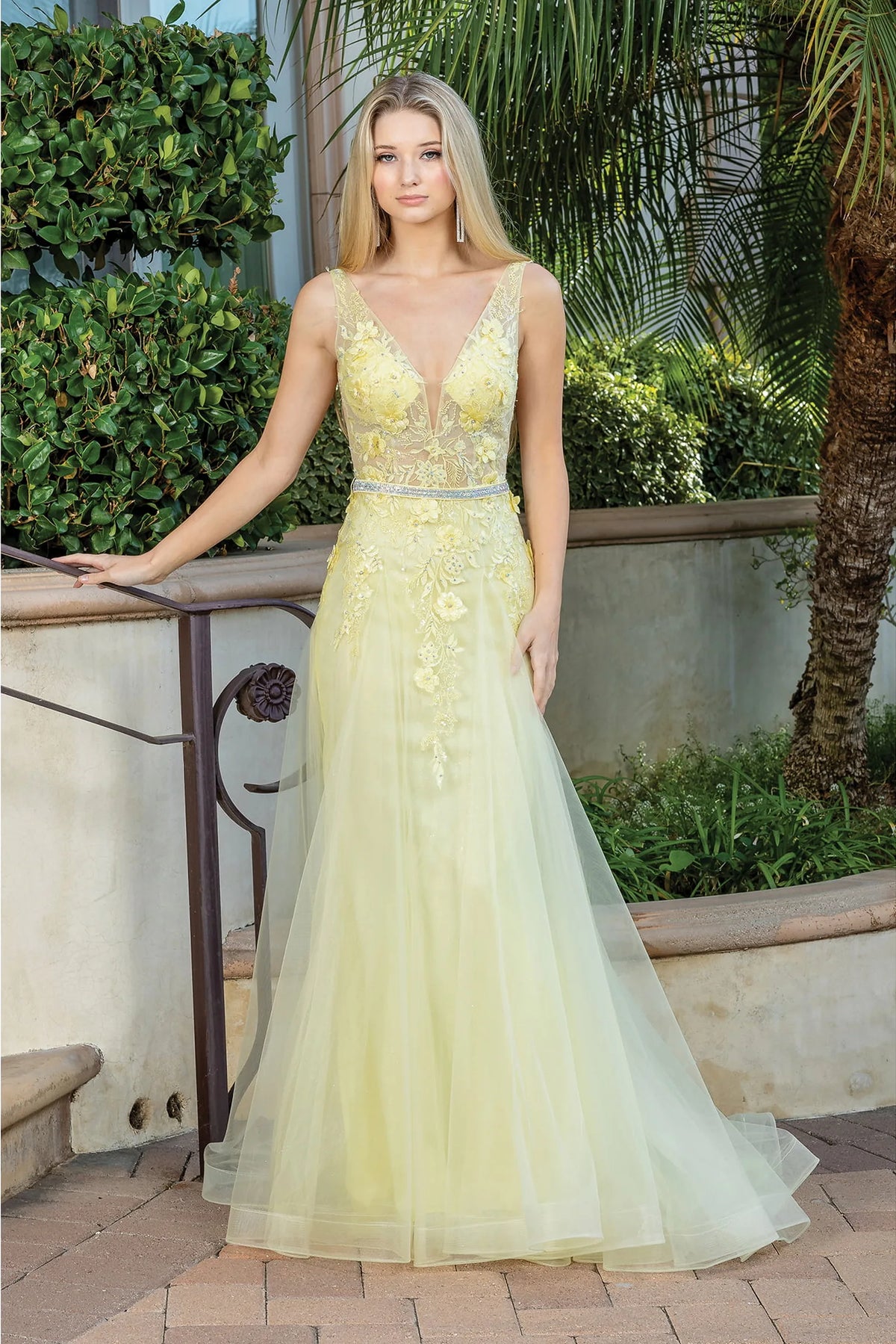 Featuring a floor-length skirt, this Yellow prom dress is shown in full view.