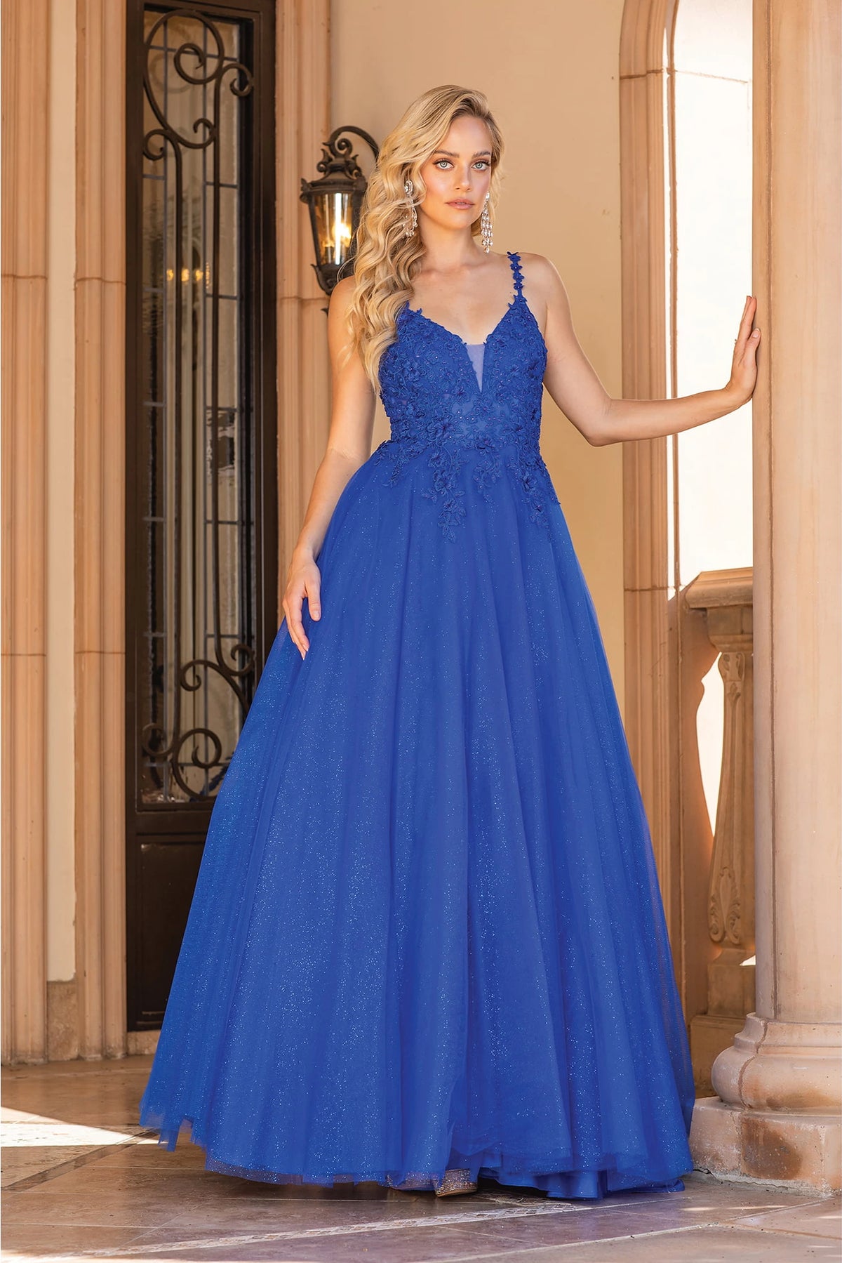 Featuring a floor-length skirt, this Royal Blue prom dress is shown in full view.
