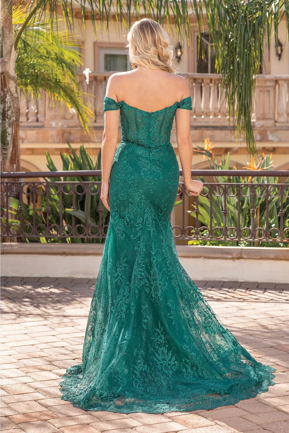 From the back, the Hunter Green prom dress reveals its floor-length skirt.