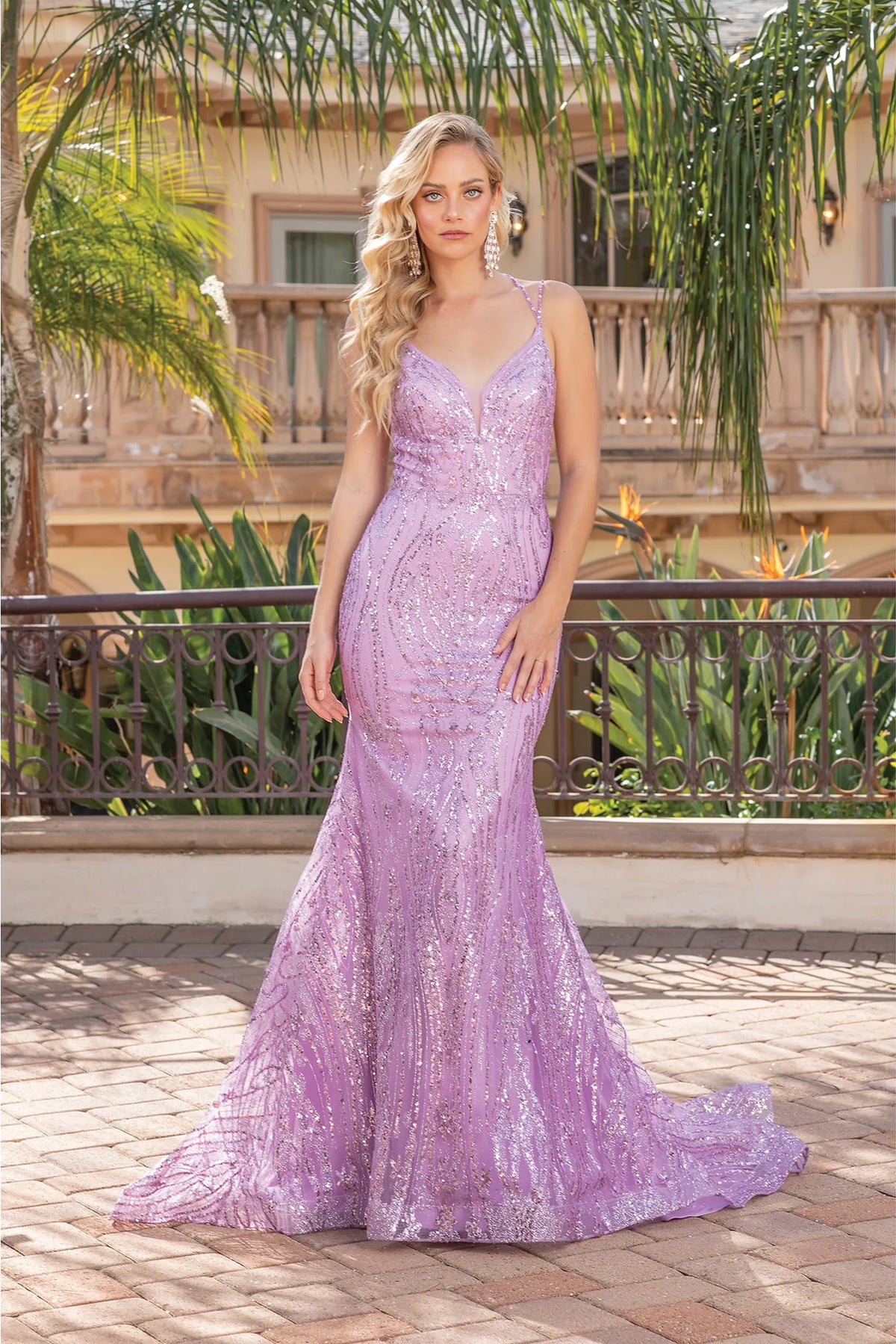 Featuring a floor-length skirt, this Lilac prom dress is shown in full view.
