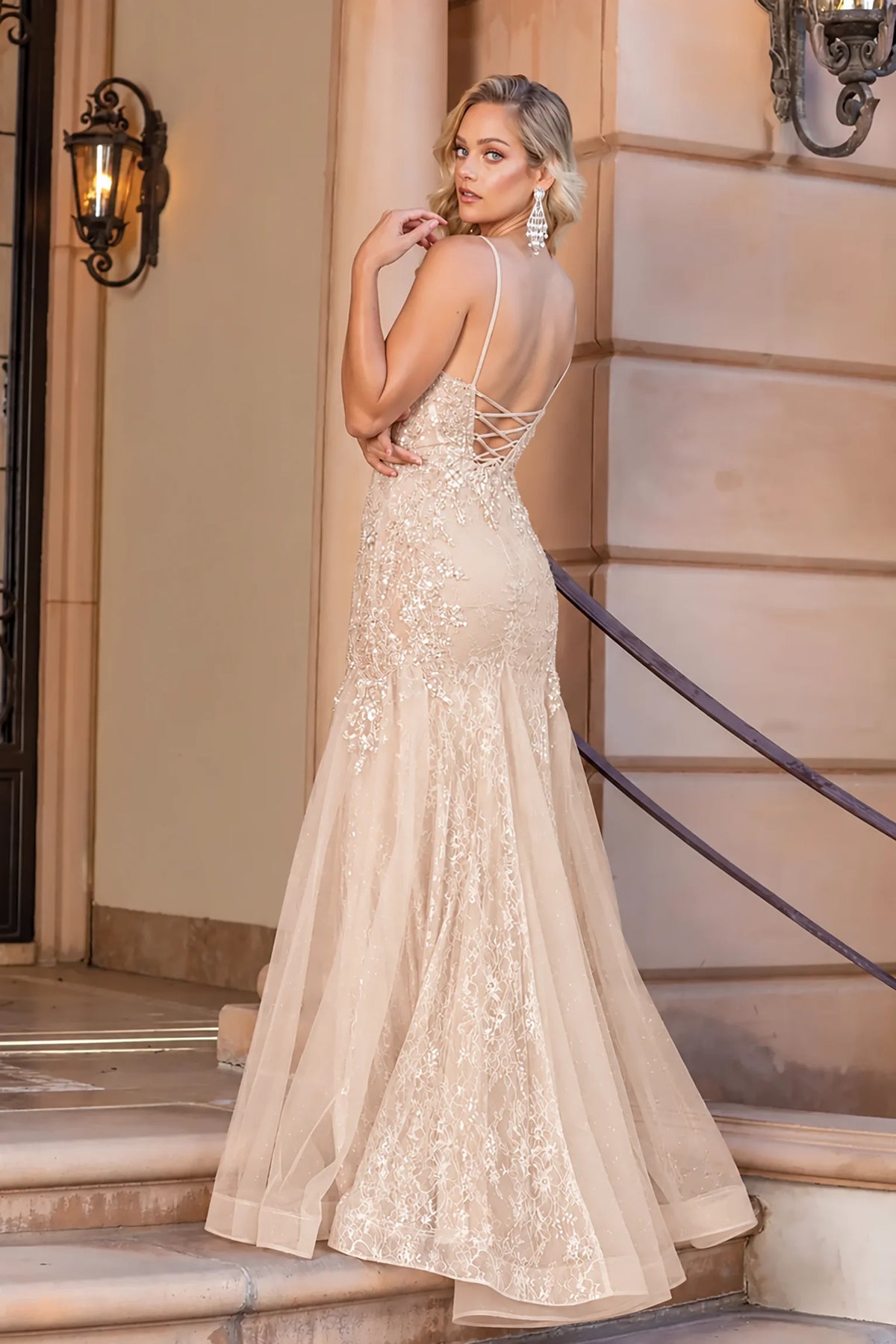 Low open back and sweeping skirt complete the Champagne Flowing Prom Dress.