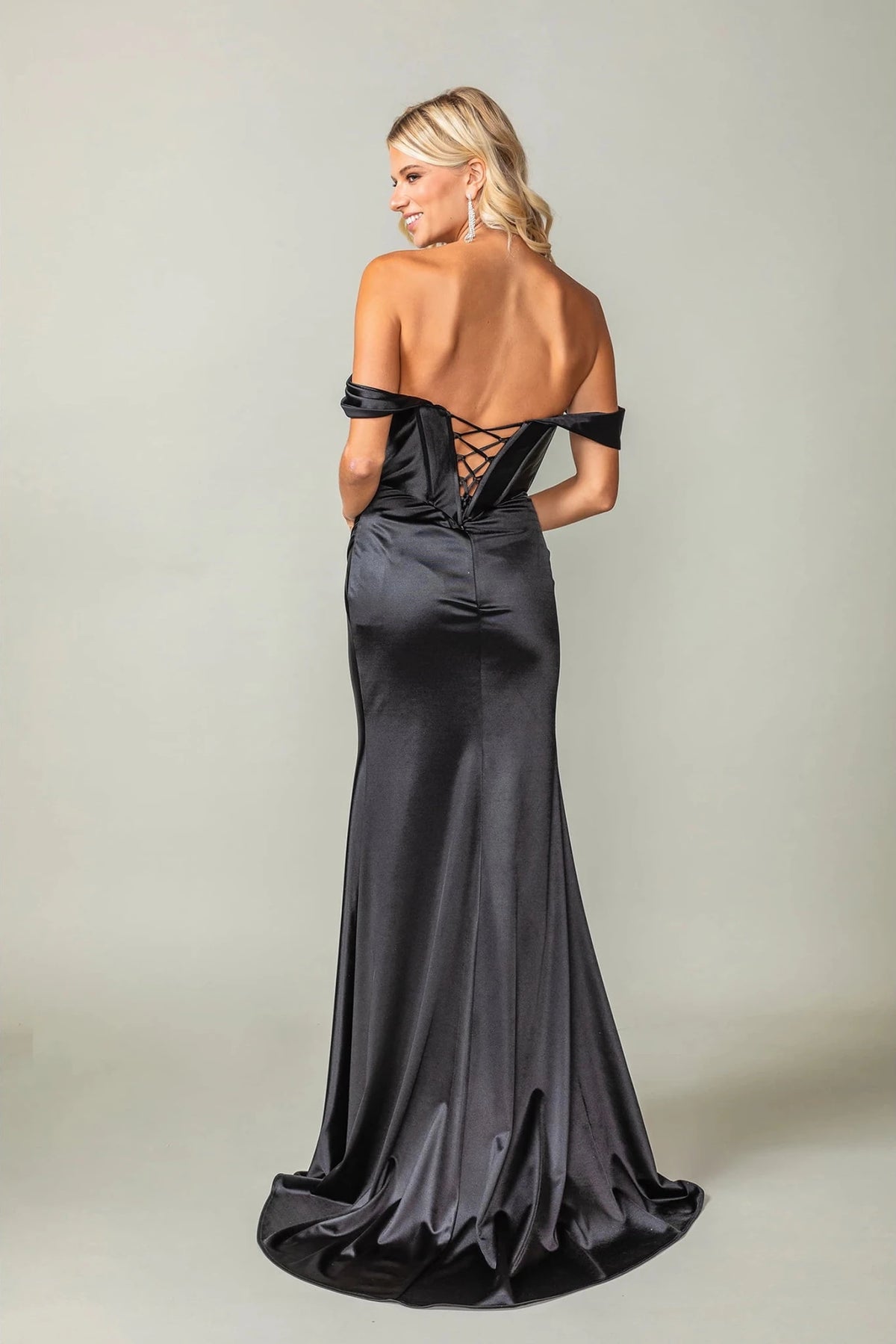 From the back, the Black prom dress reveals its floor-length skirt.