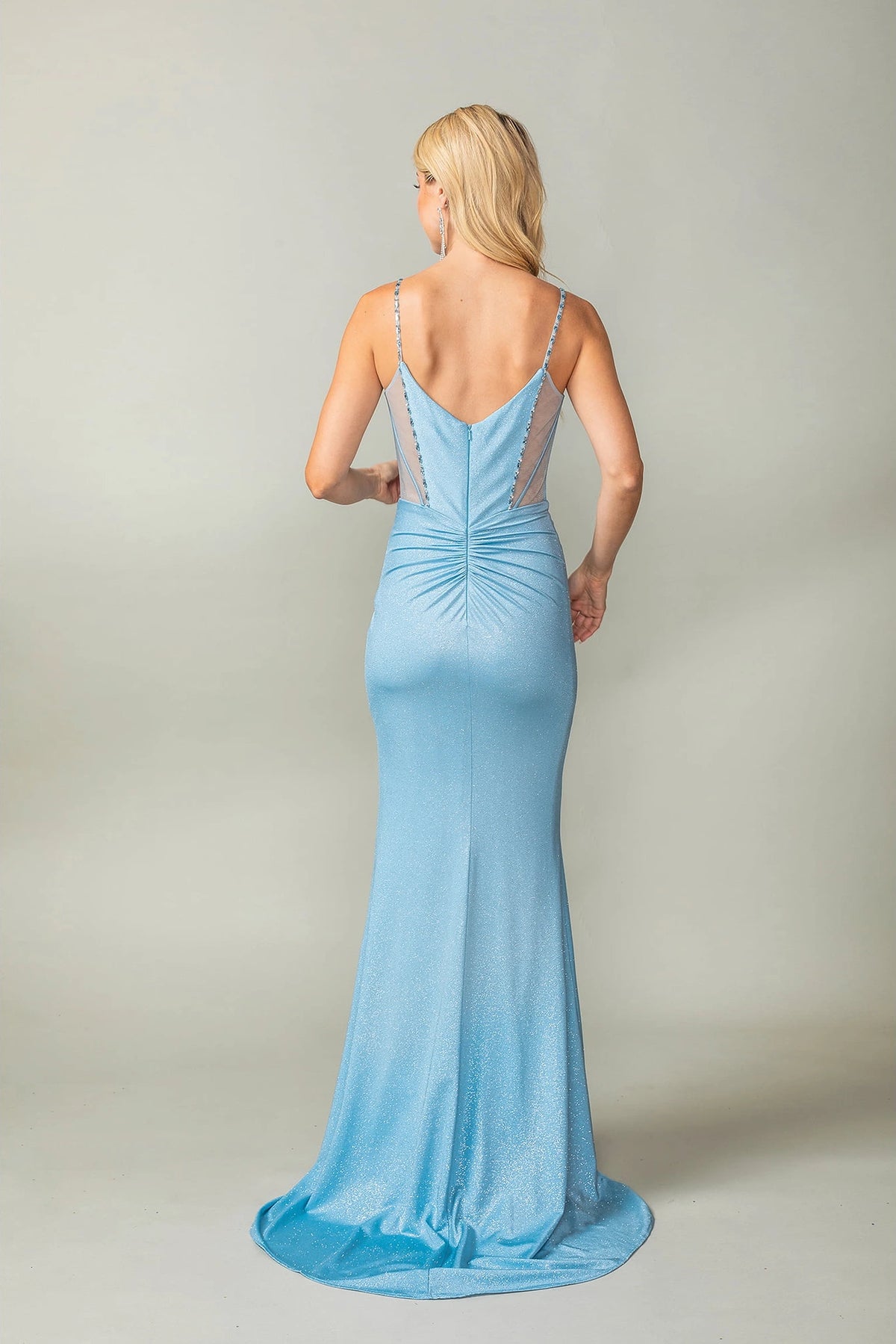 From the back, the Dusty Blue prom dress reveals its floor-length skirt.