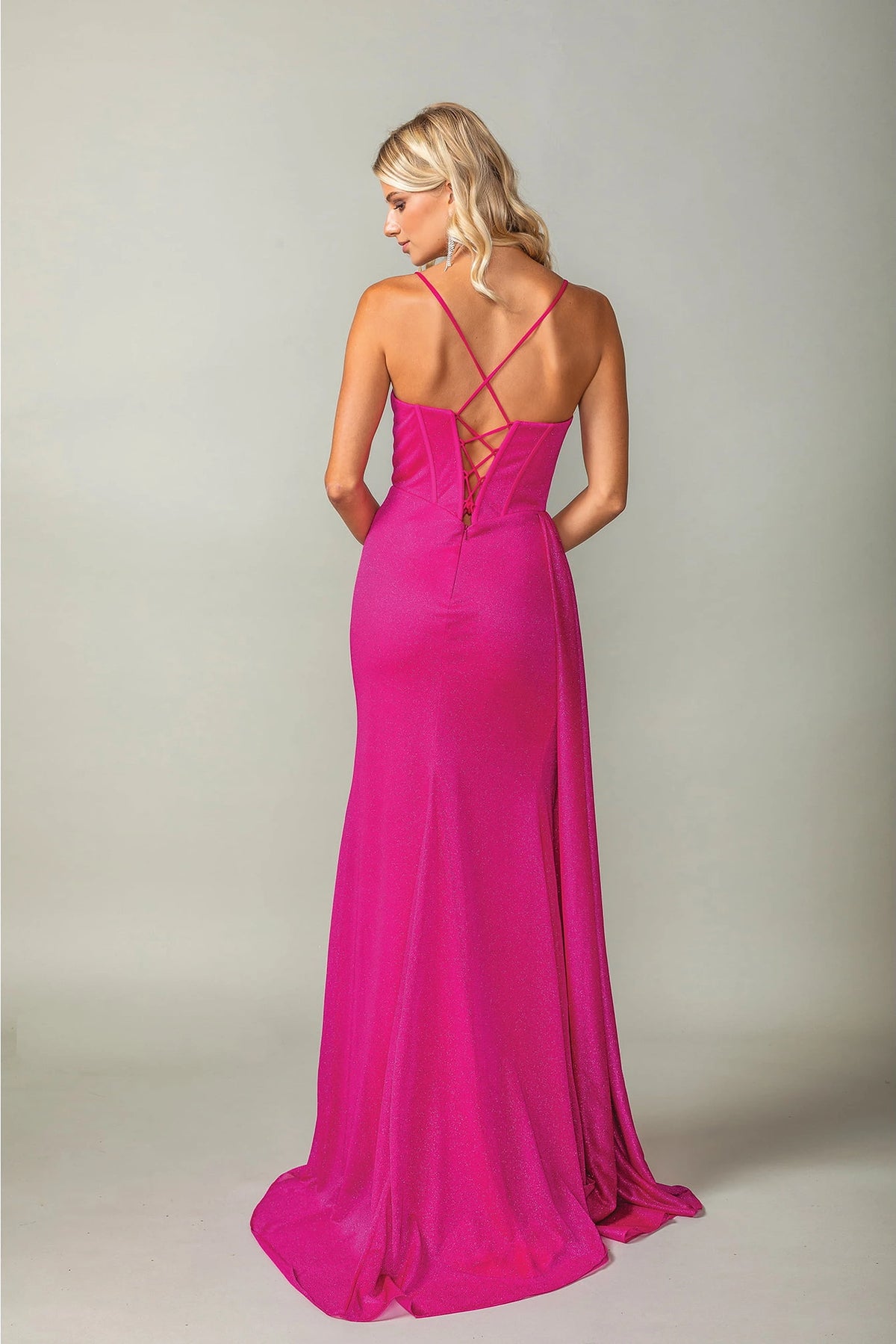 From the back, the Fuchsia prom dress reveals its floor-length skirt.