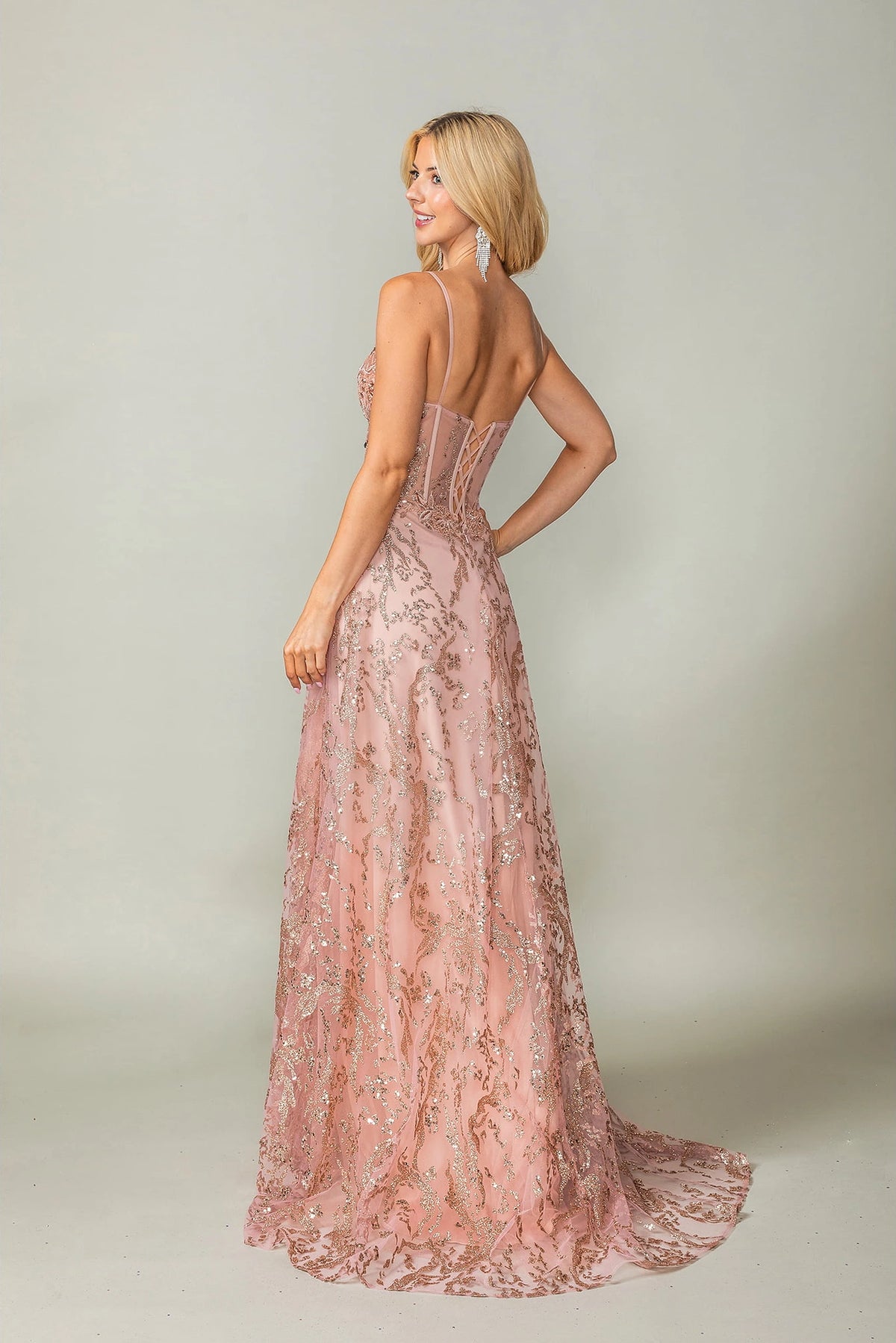 From the back, the Rose Gold prom dress reveals its floor-length skirt.