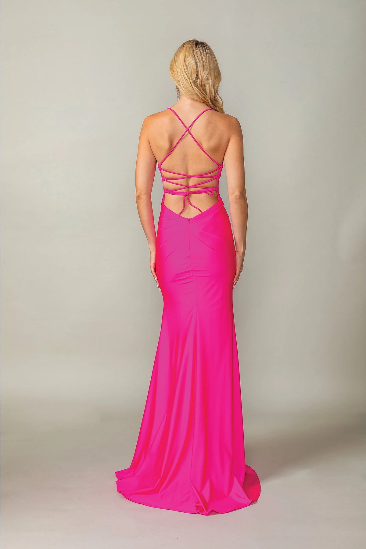From the back, the Fuchsia prom dress reveals its floor-length skirt.