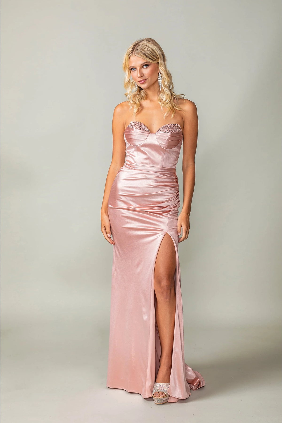 Featuring a floor-length skirt, this Rose Gold prom dress is shown in full view.