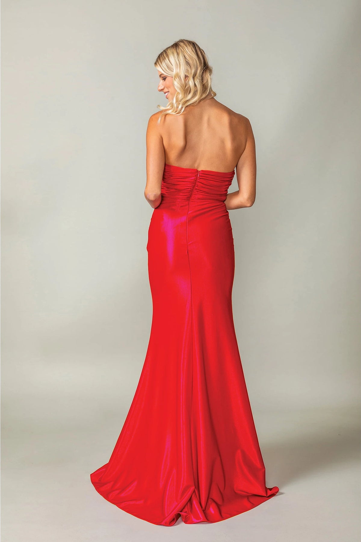 From the back, the Red prom dress reveals its floor-length skirt.