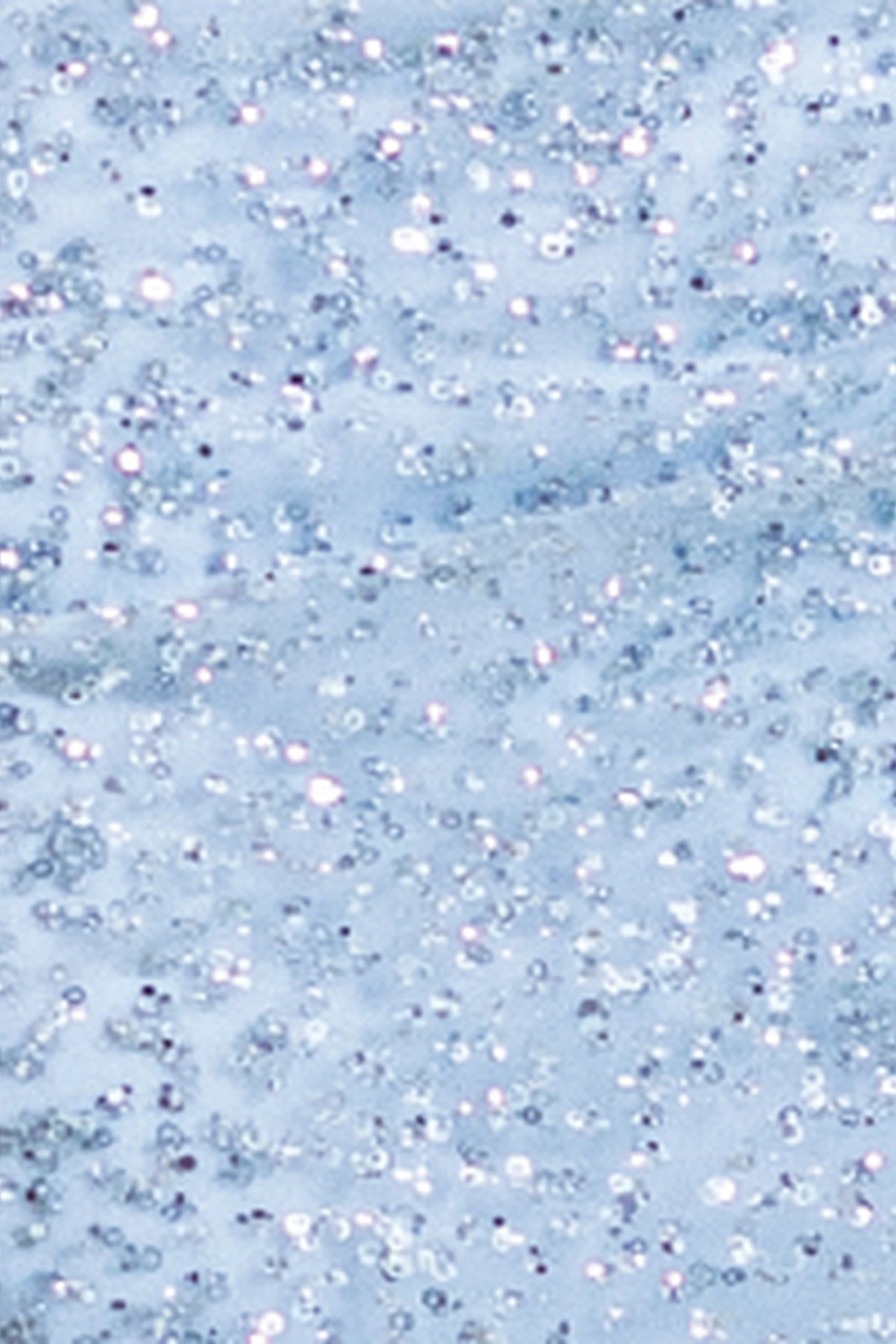 Featuring textured embellishments, this Bahama Blue prom dress is shown in detail.