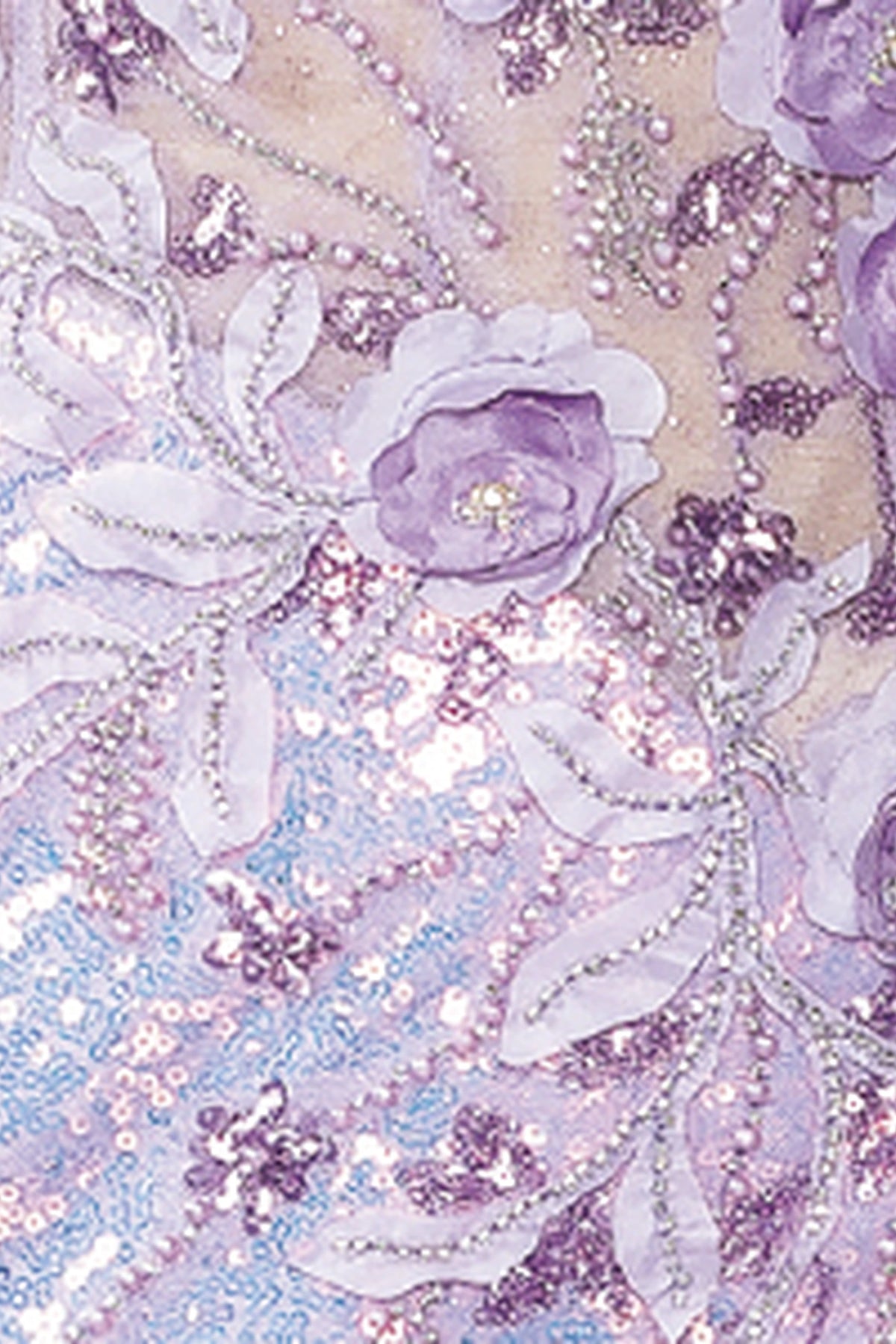 Featuring textured embellishments, this Lilac prom dress is shown in detail.