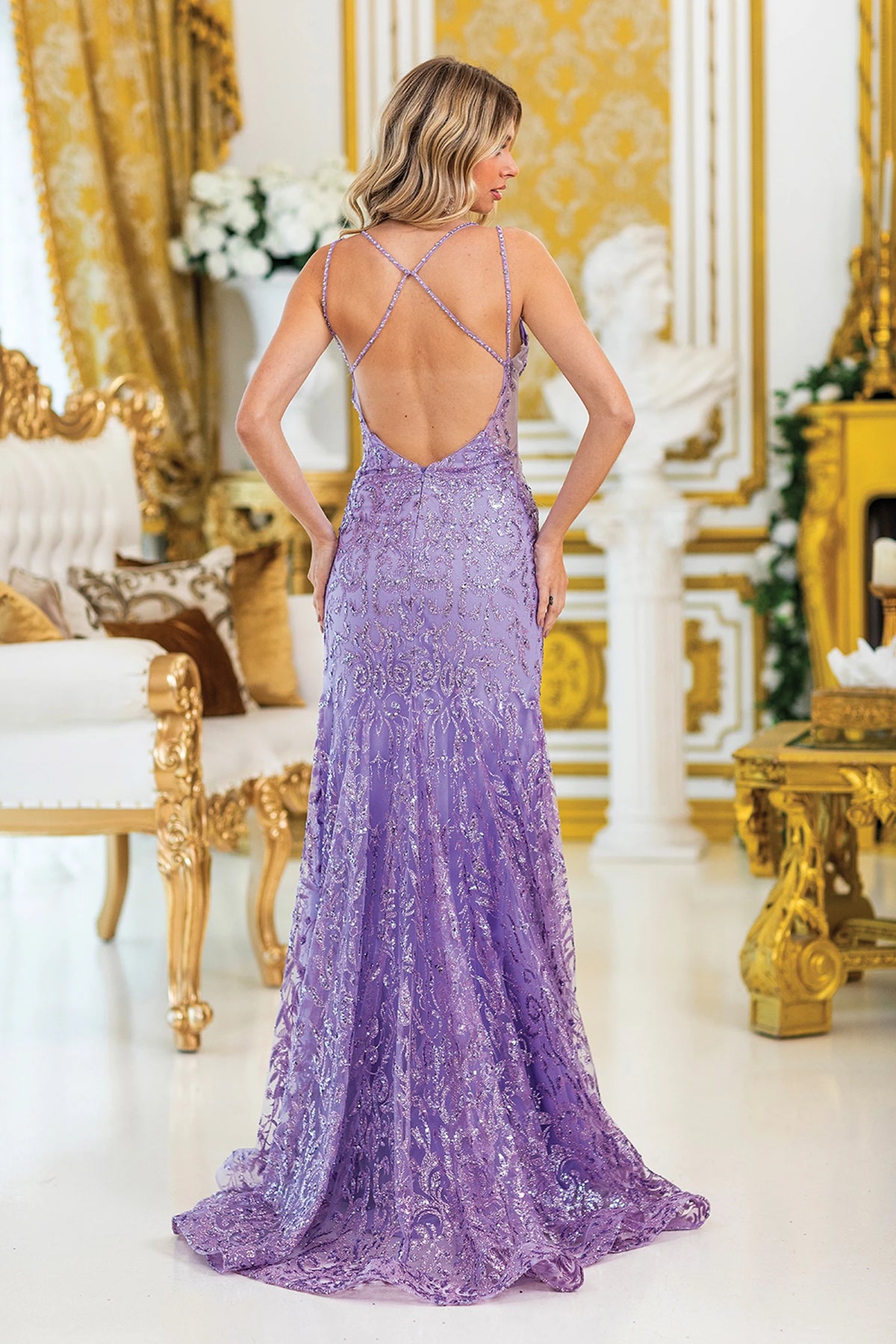 From the back, the Lilac prom dress reveals its floor-length skirt.