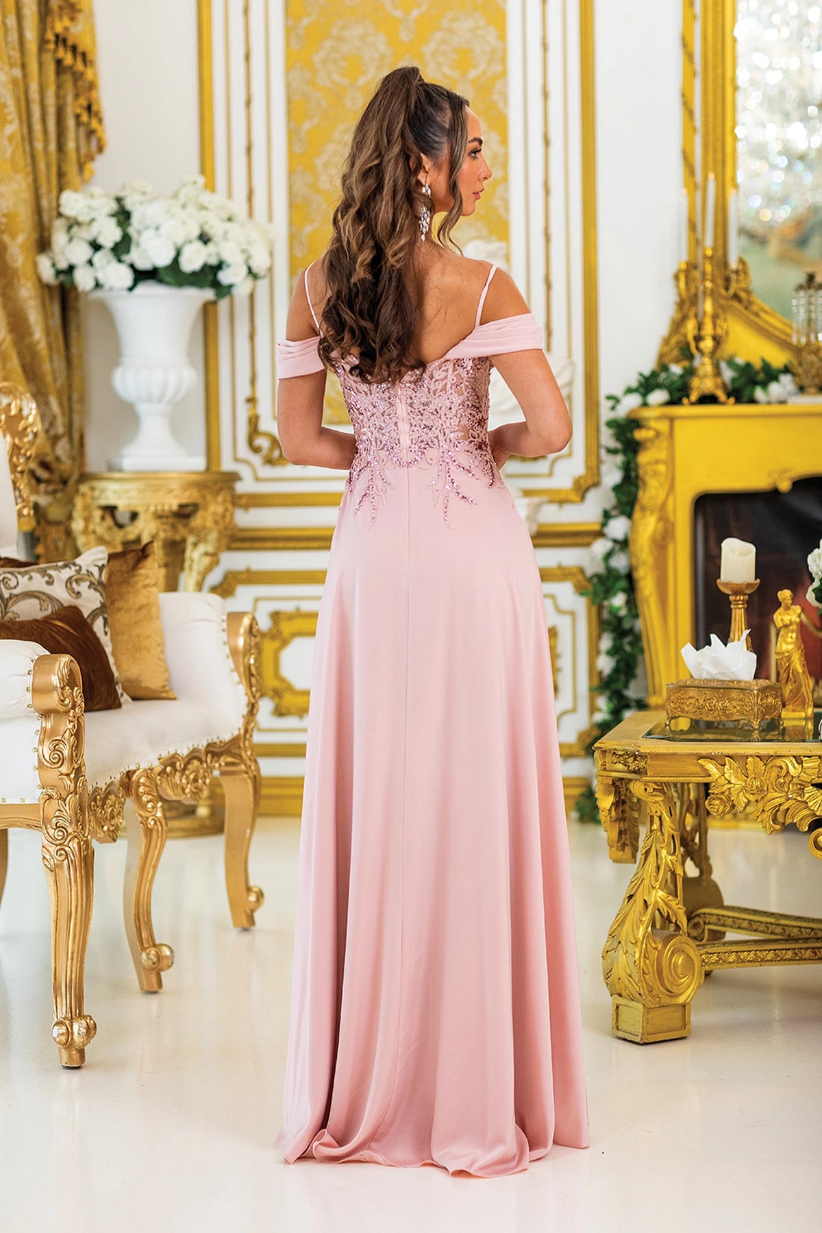 From the back, the Blush prom dress reveals its floor-length skirt.