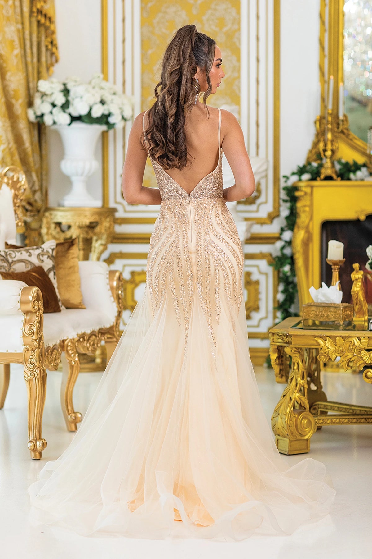 From the back, the Champagne prom dress reveals its floor-length skirt.