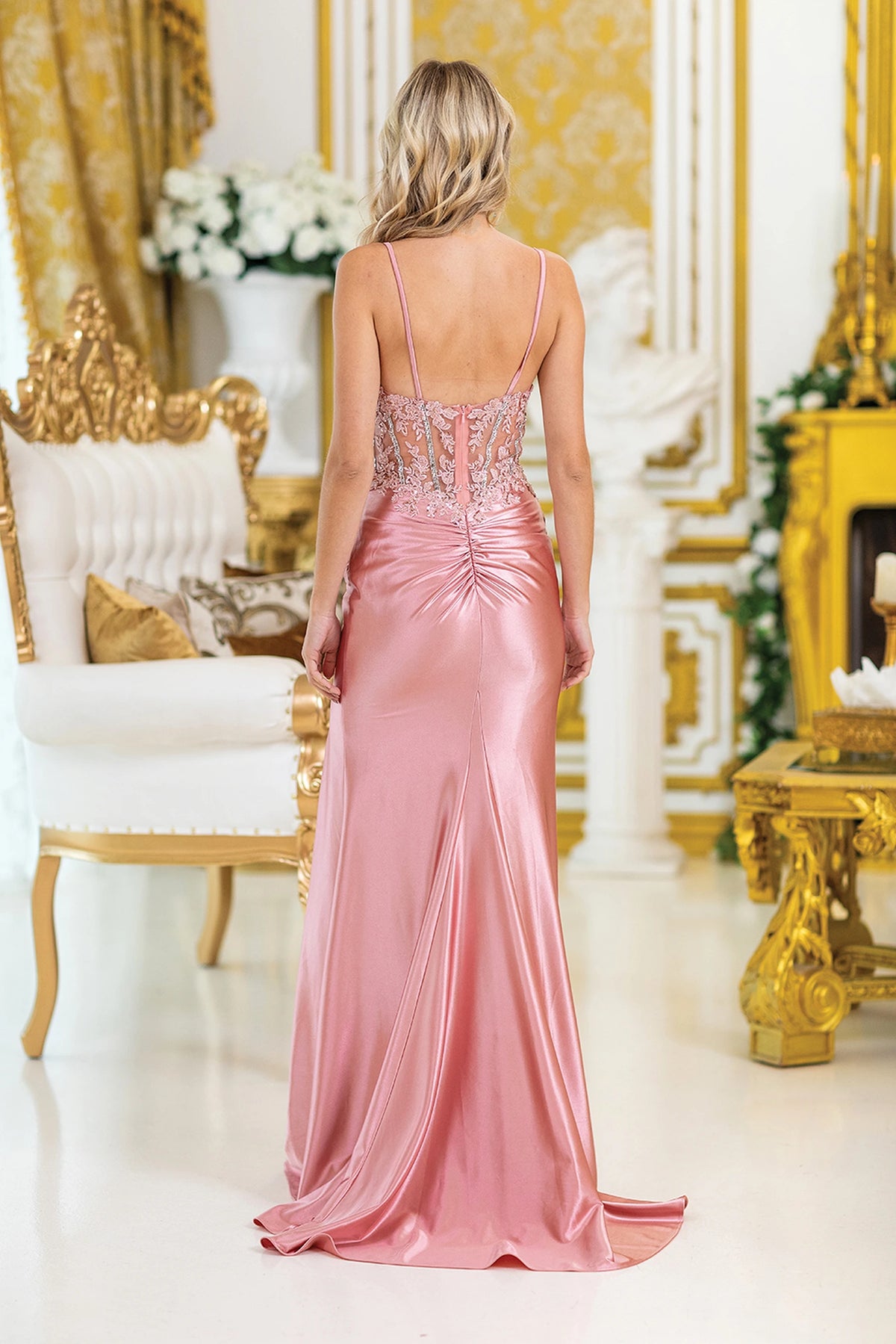 From the back, the Rose Gold prom dress reveals its floor-length skirt.