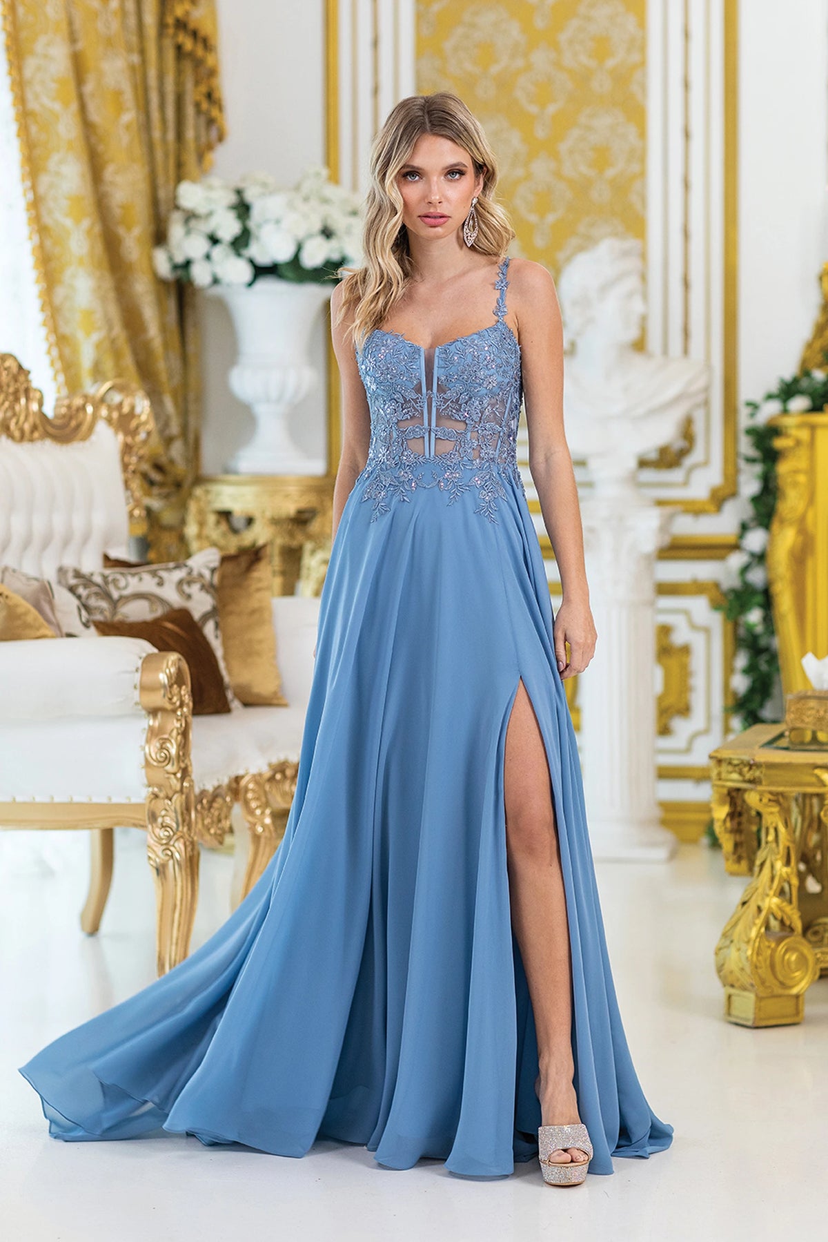 Featuring a floor-length skirt, this Dusty Blue prom dress is shown in full view.