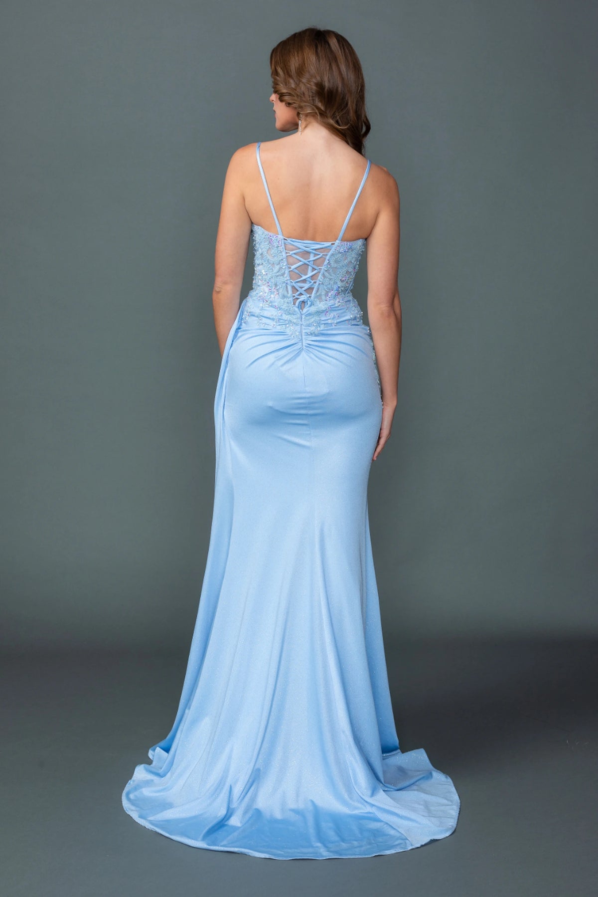 From the back, the Bahama Blue prom dress reveals its floor-length skirt.
