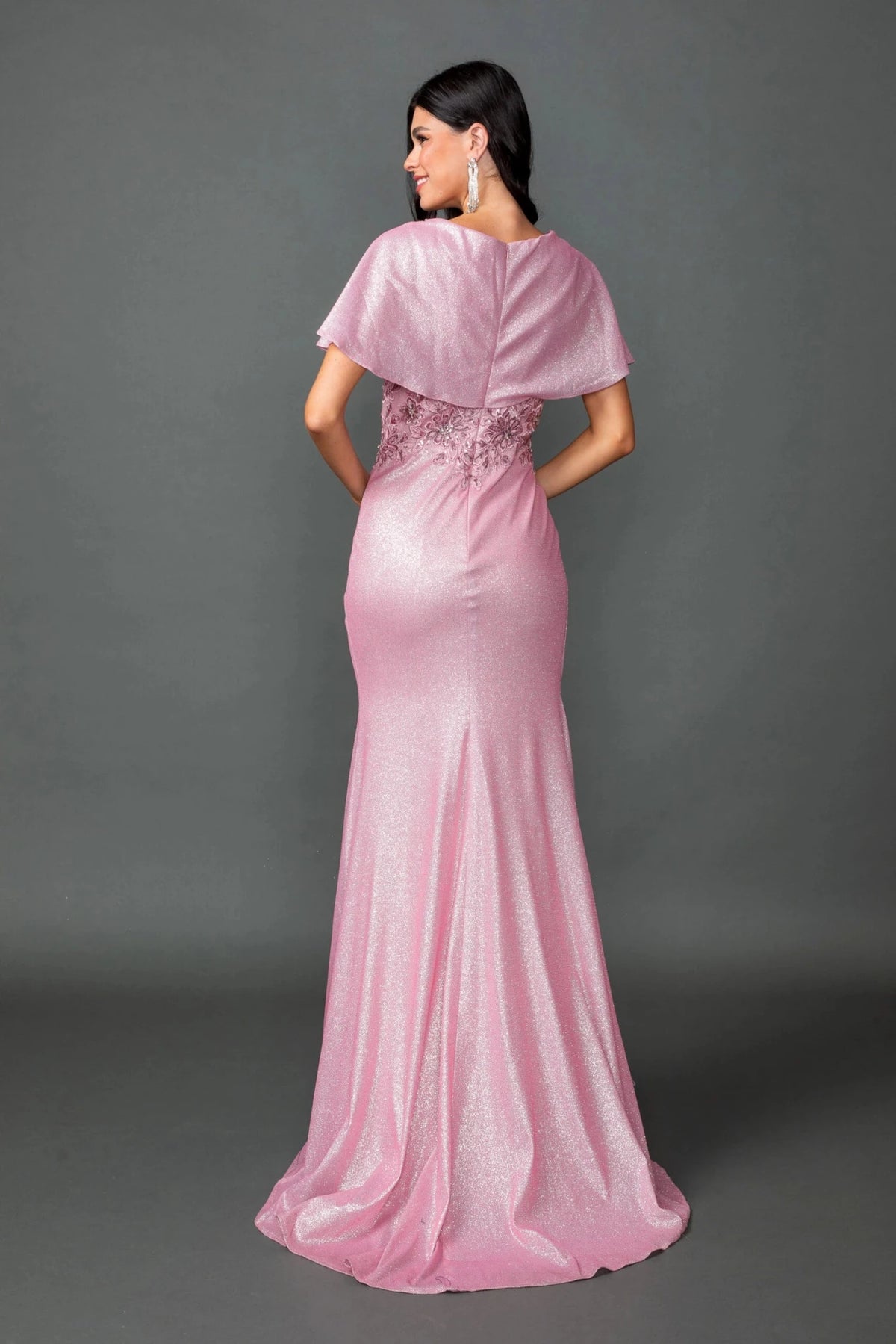 From the back, the Blush prom dress reveals its floor-length skirt.