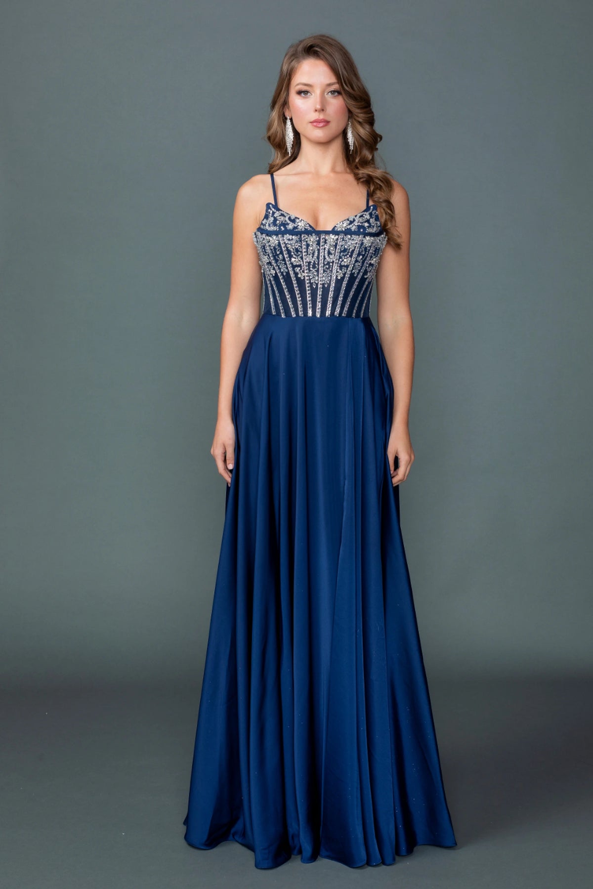 Featuring a floor-length skirt, this Navy prom dress is shown in full view.